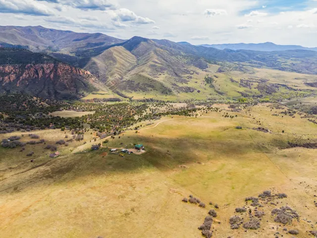 View of mountain backdrop with rural landscape