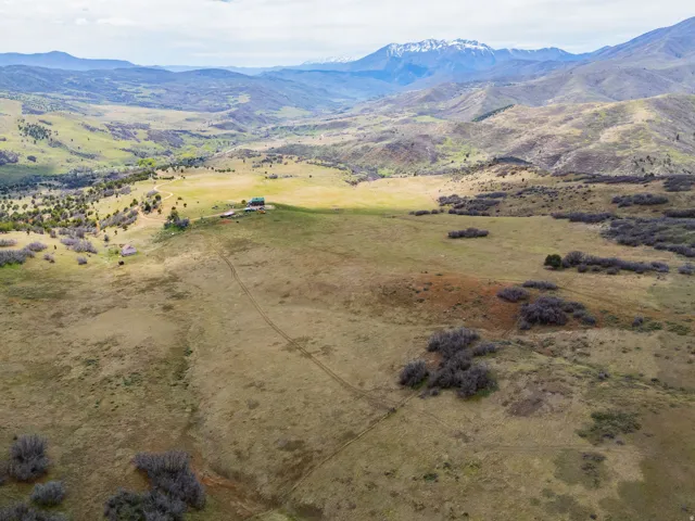 Overview of rural landscape featuring a mountainous background