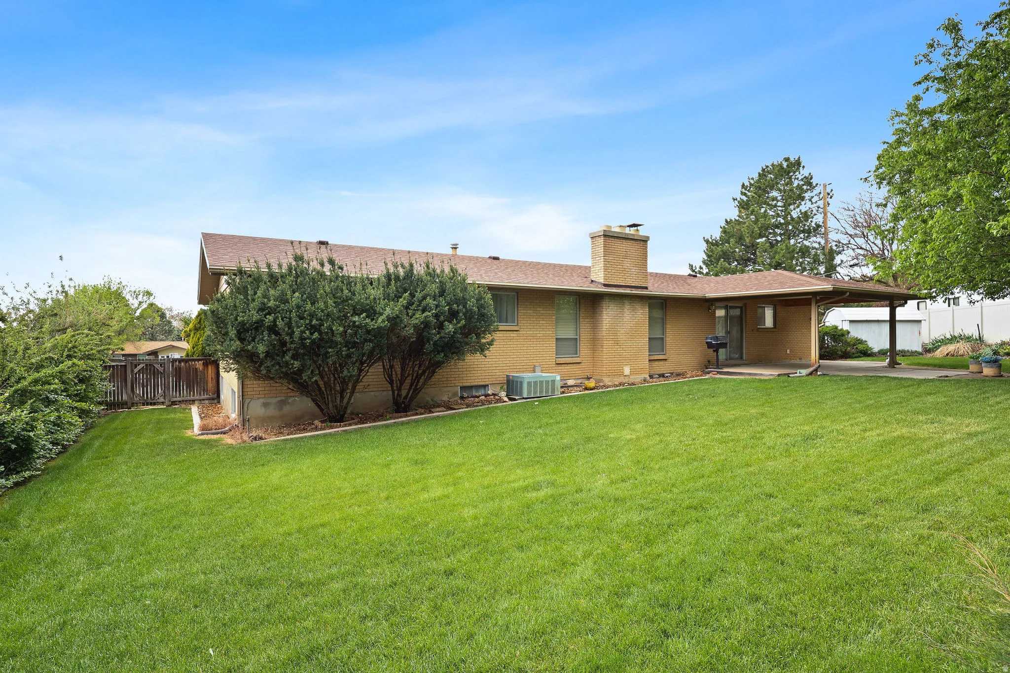 Rear view of property featuring a chimney