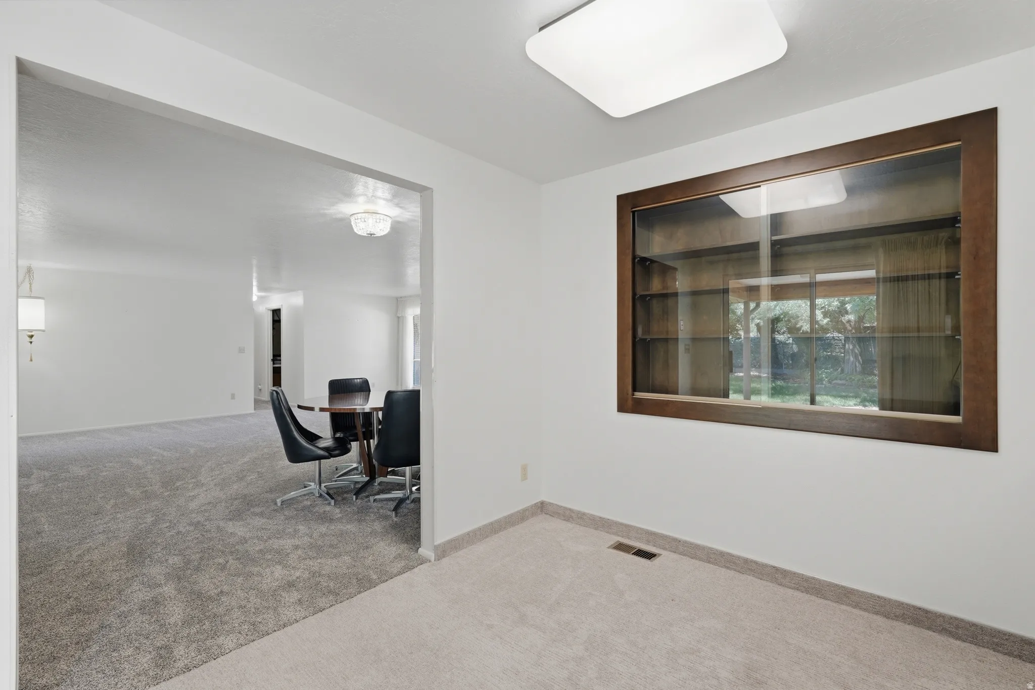 Built-in display cabinet with wood-finish frame