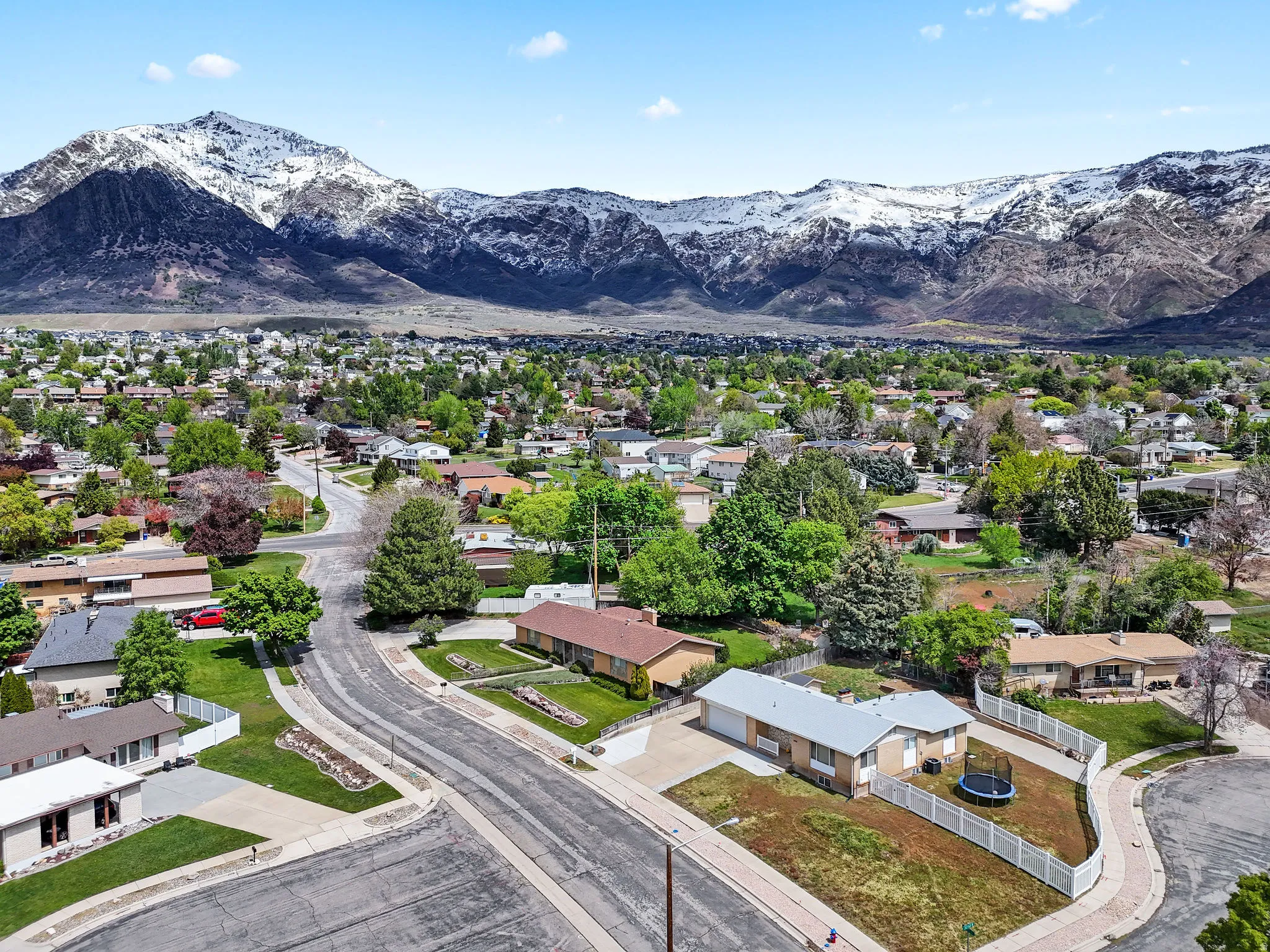 Aerial view of residential area featuring a mountain backdrop