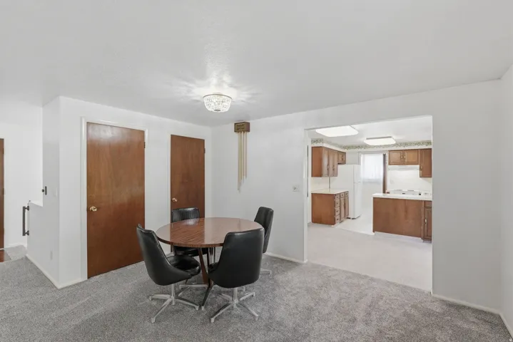 Dining area featuring a crystal flush-mount light fixture