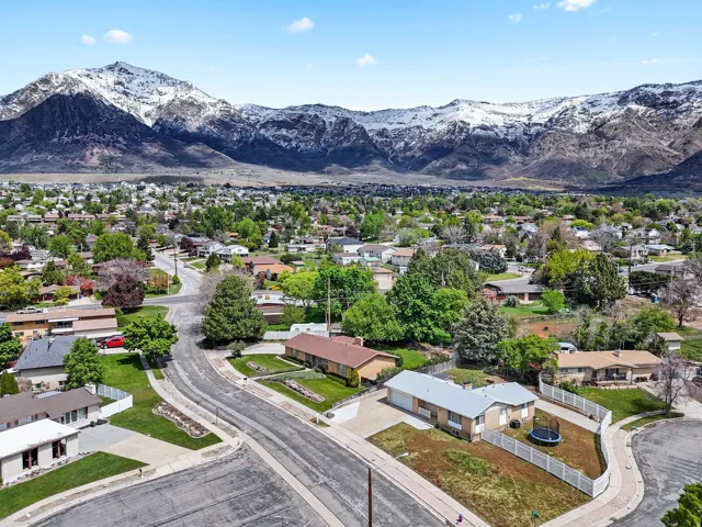 Aerial view of residential area featuring a mountain backdrop