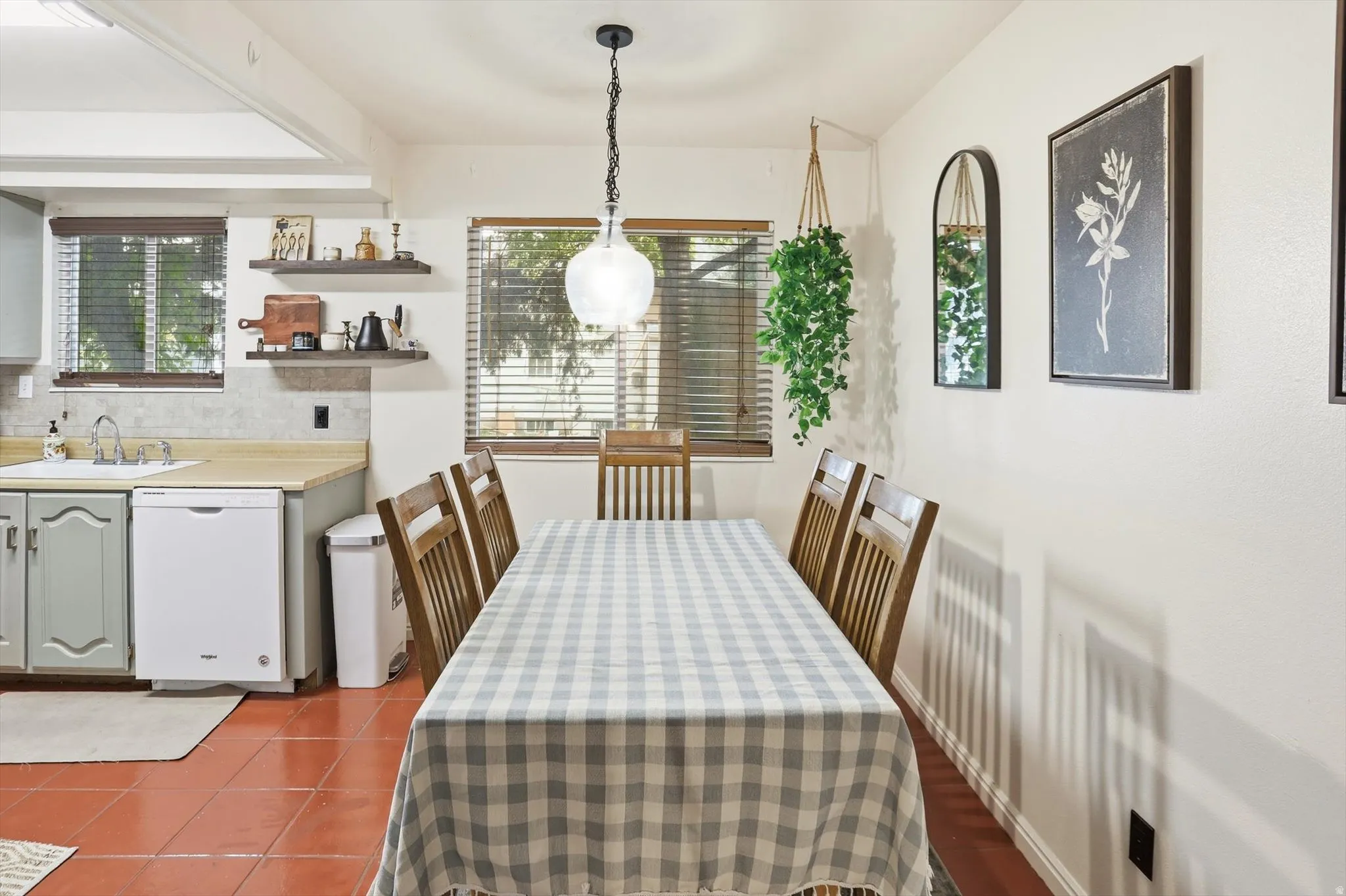 Dining area featuring dark tile patterned floors
