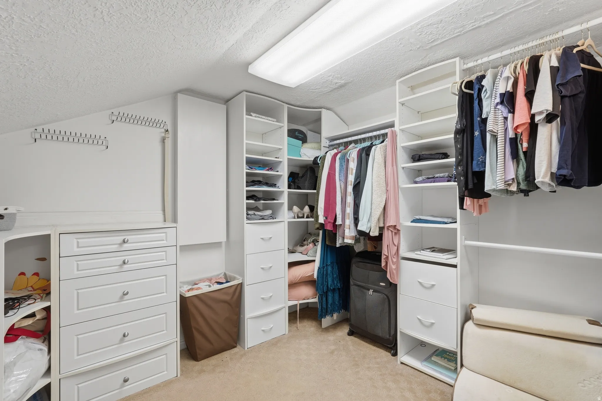 1 of 2  Walk in closets with light colored carpet