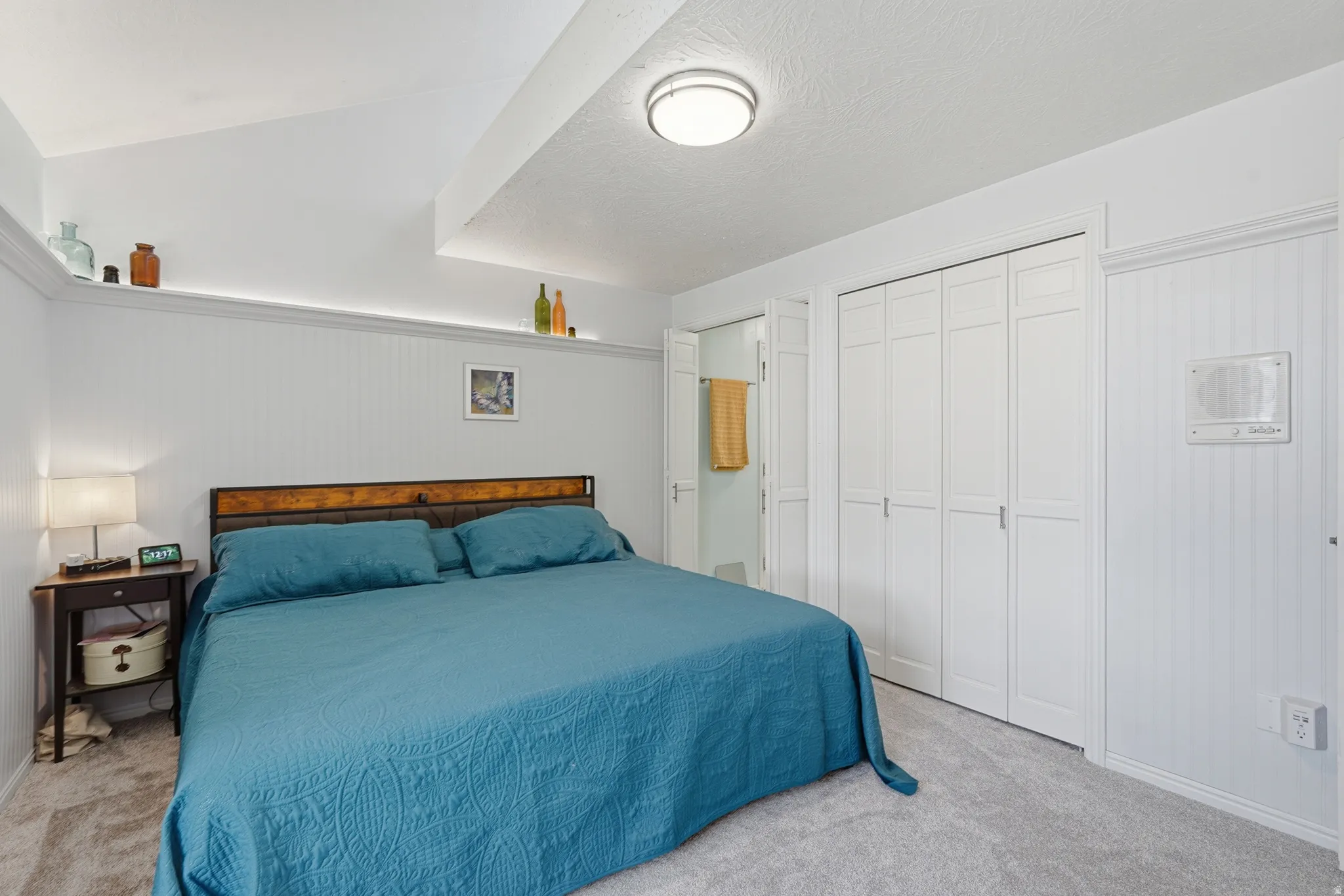 Bedroom with lofted ceiling, and ensuite bathroom