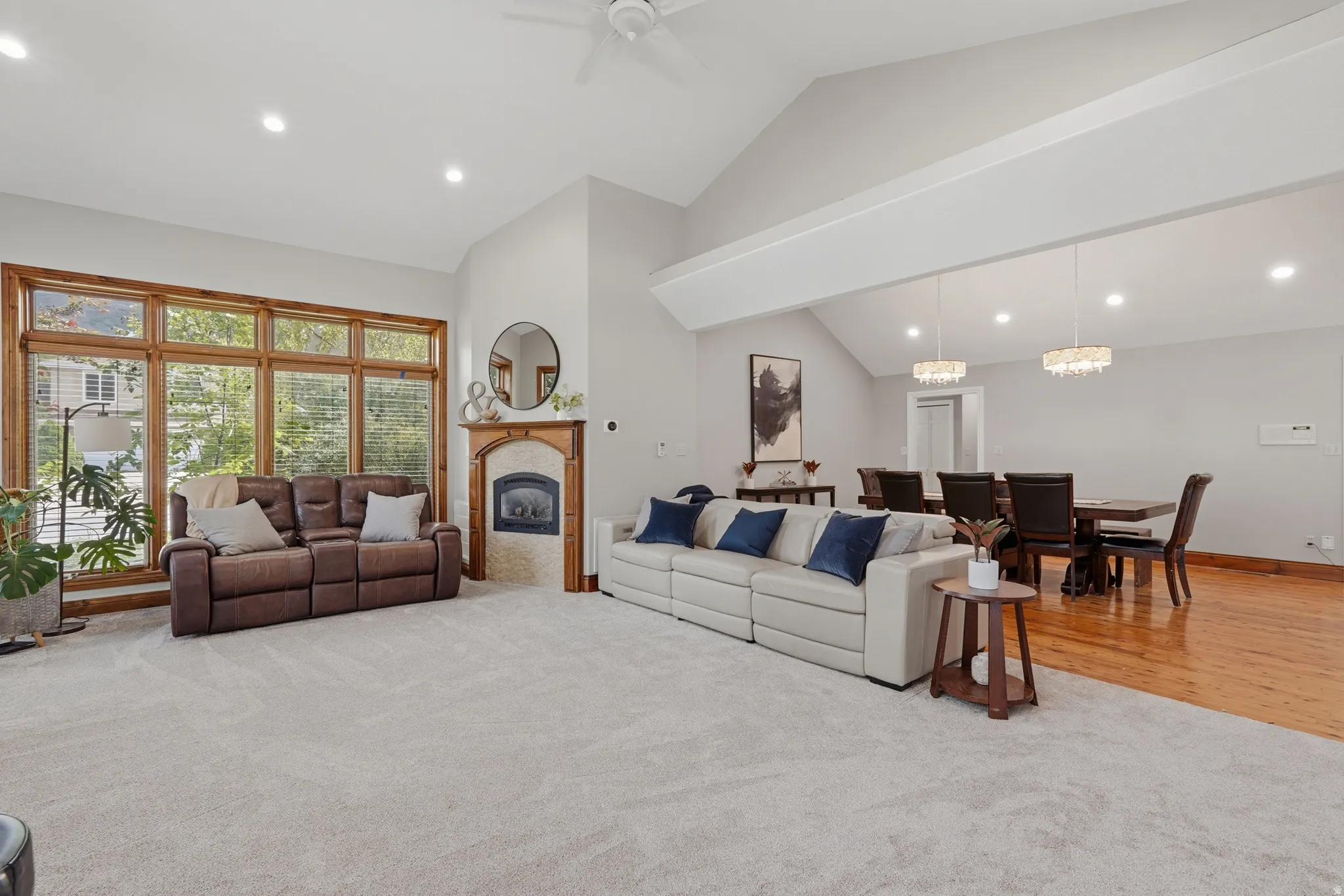 Great room featuring a high ceiling, fireplace, French door access to covered patio