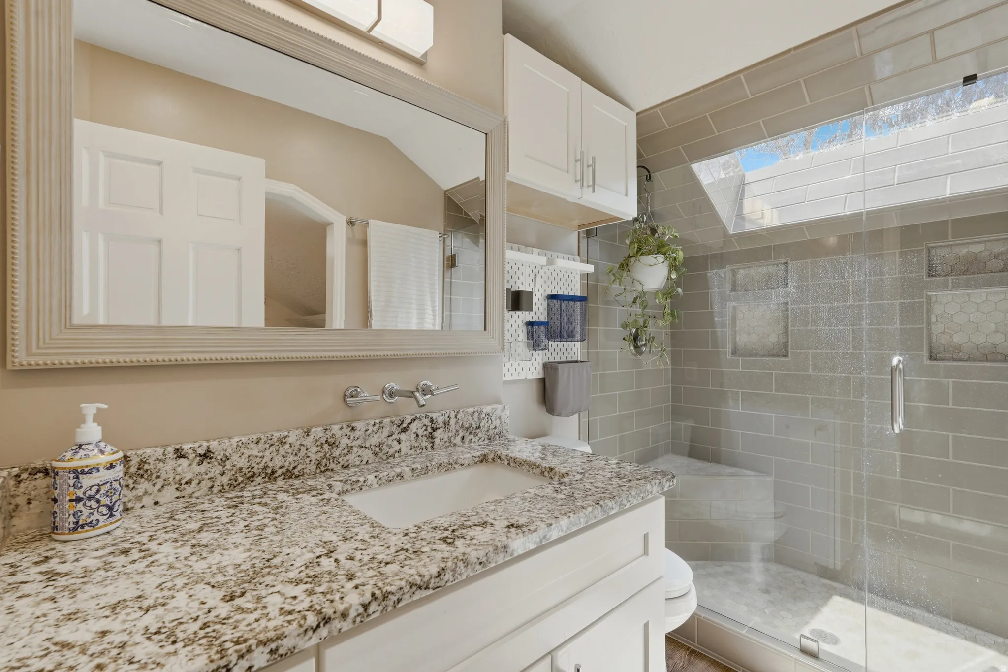 Primary Bathroom with a stall shower and vanity