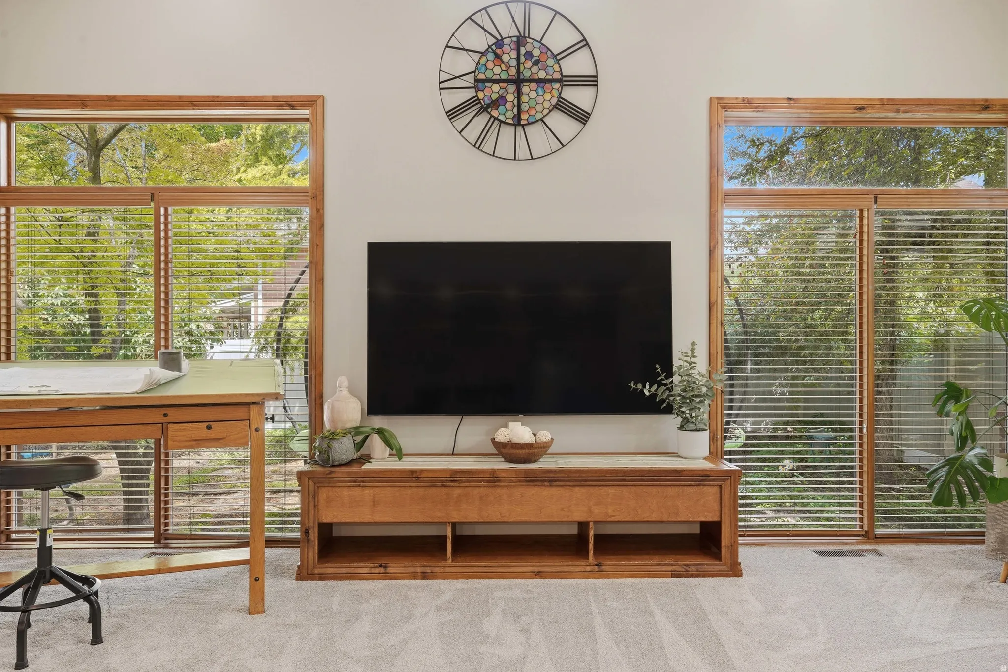 Great room featuring a high ceiling, fireplace, French door access to covered patio