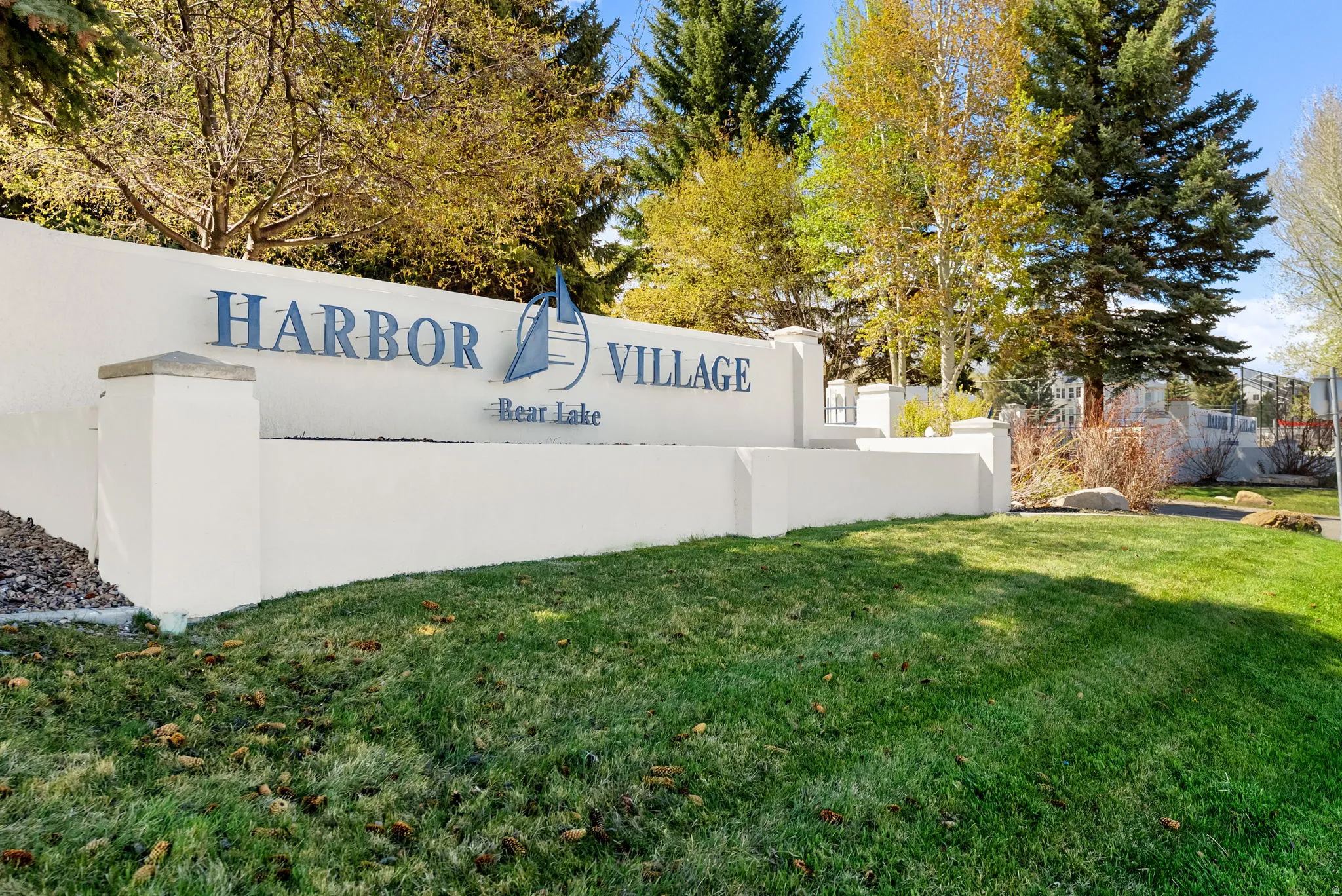 Community / neighborhood sign with a lawn