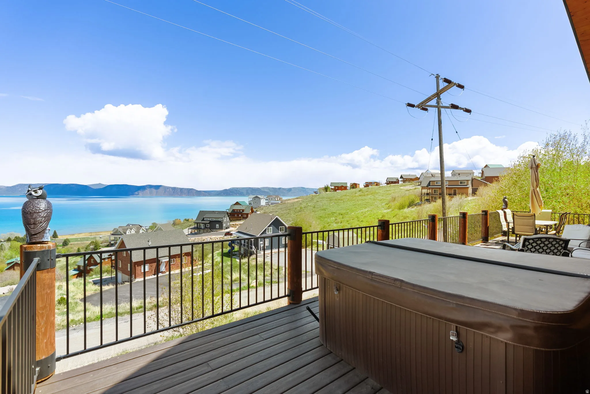 Deck with a mountain view and a hot tub