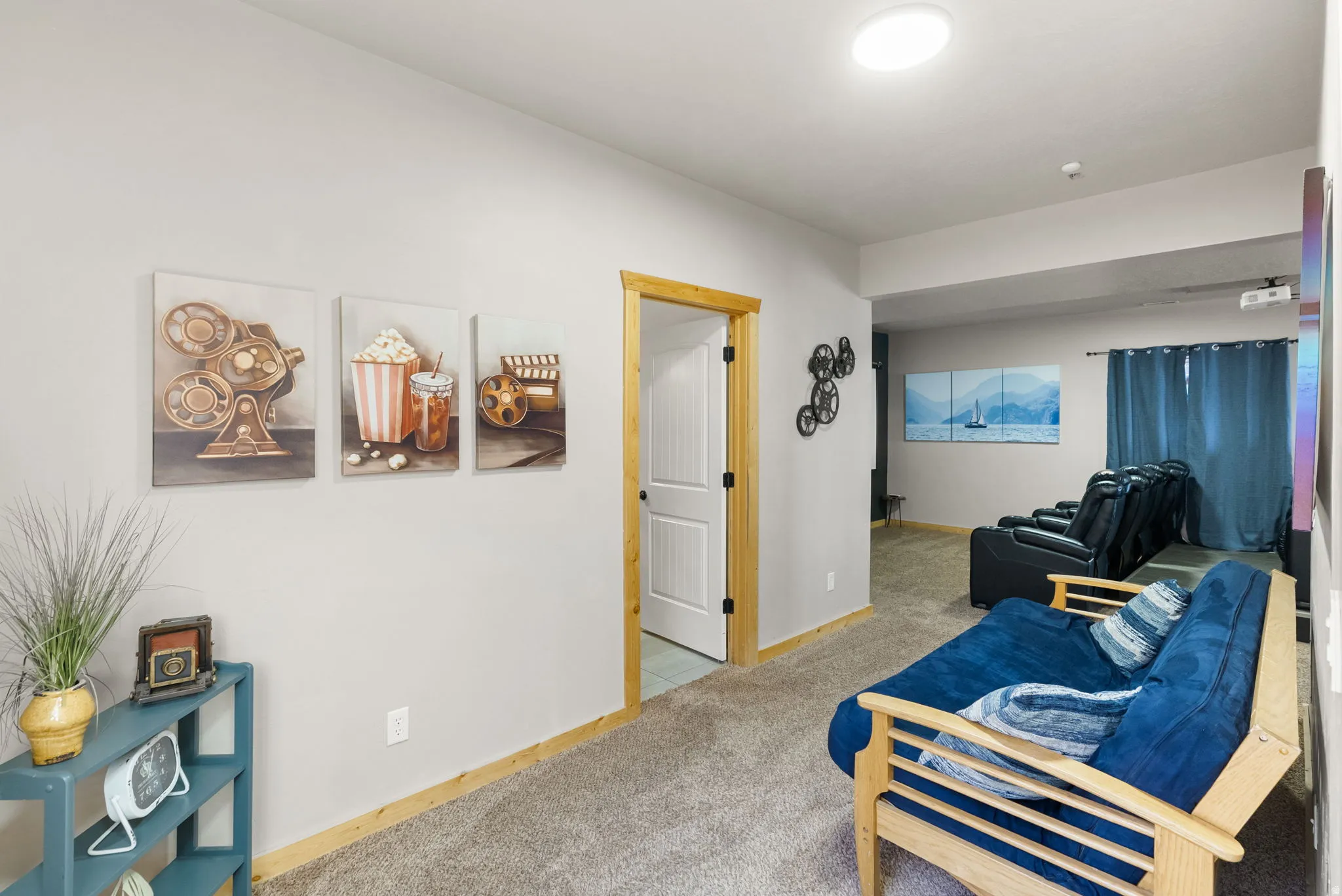 Sitting room featuring light carpet and baseboards
