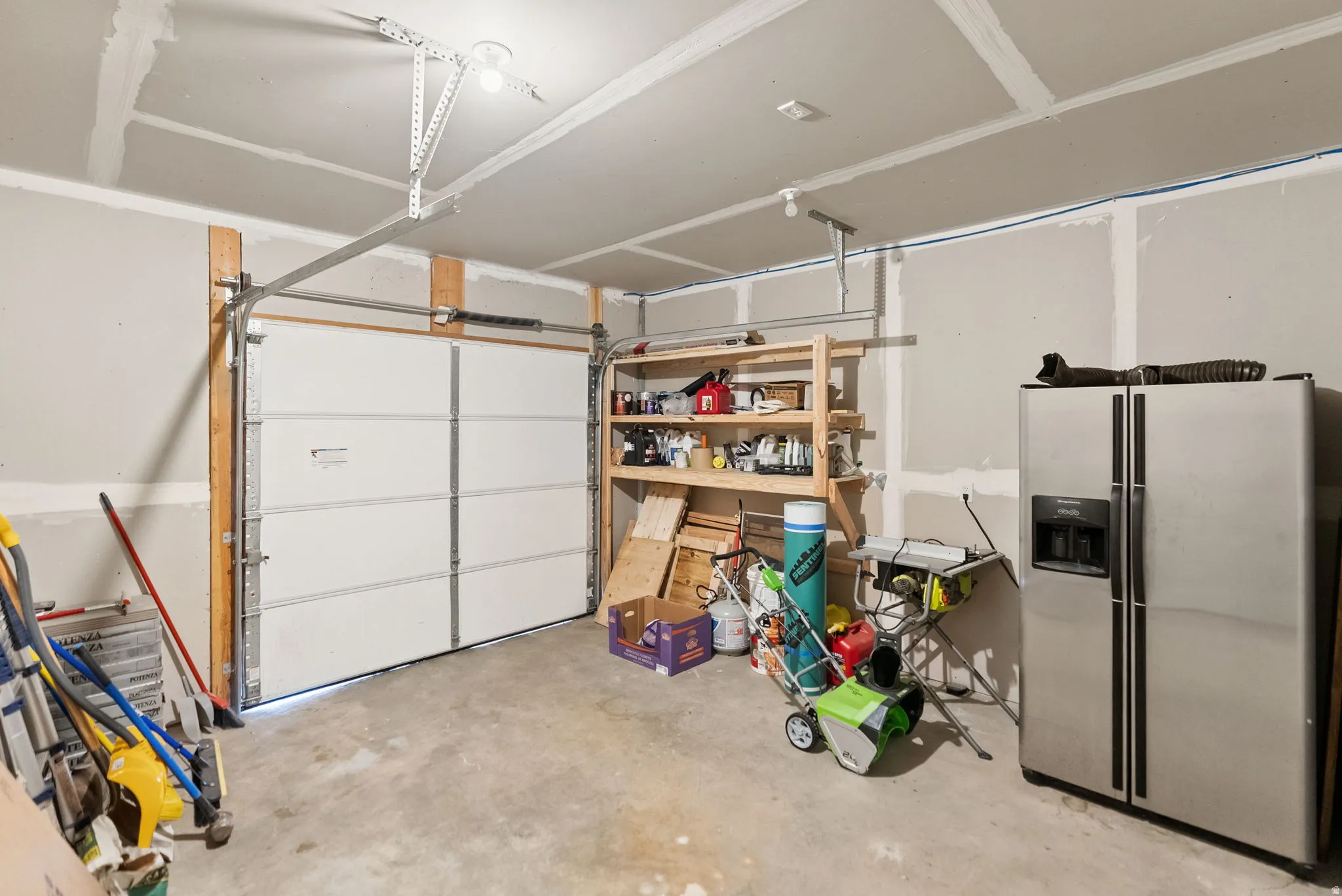 Garage with stainless steel fridge