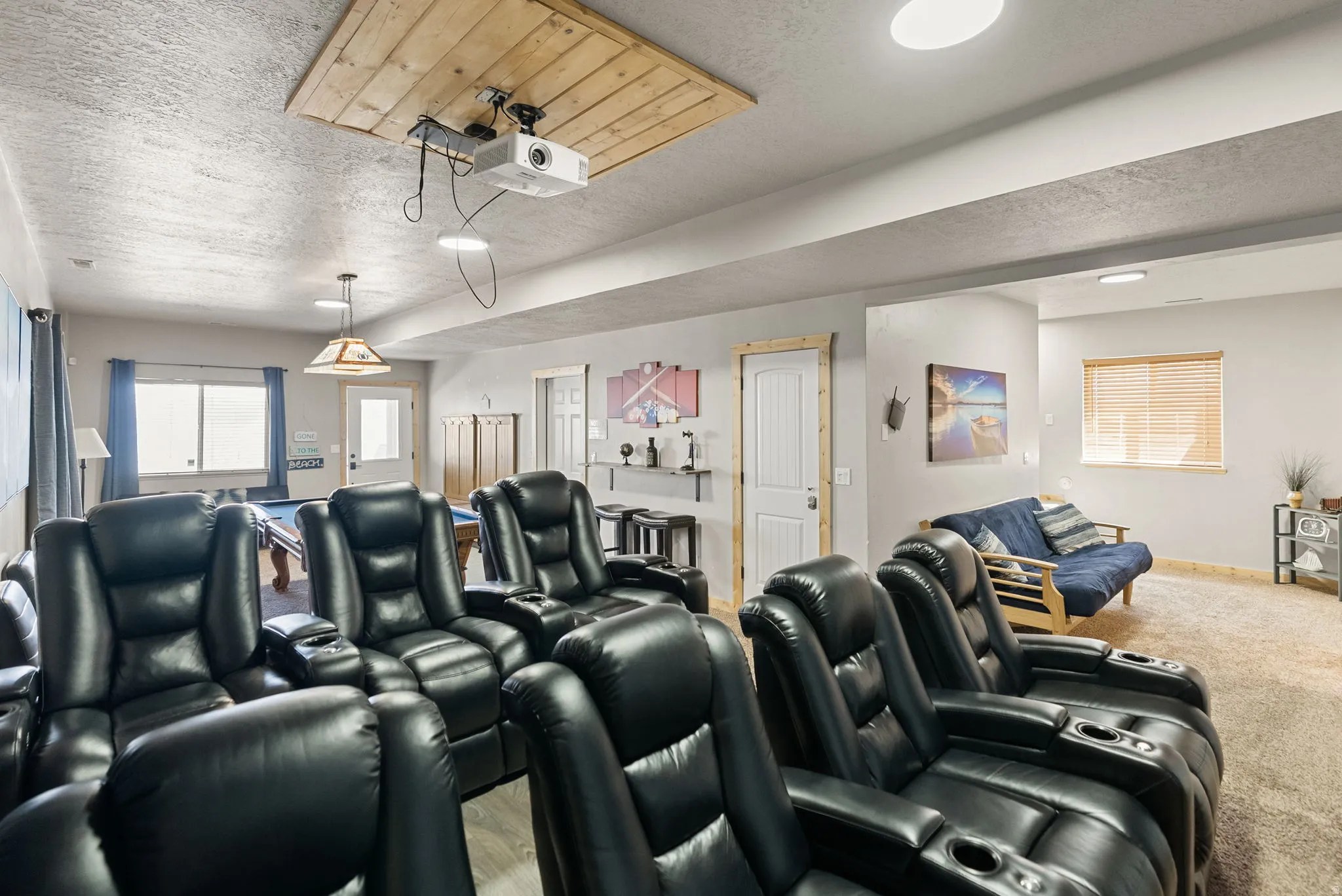 Home theater room with a textured ceiling
