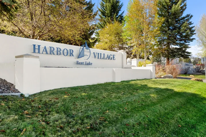 Community / neighborhood sign with a lawn