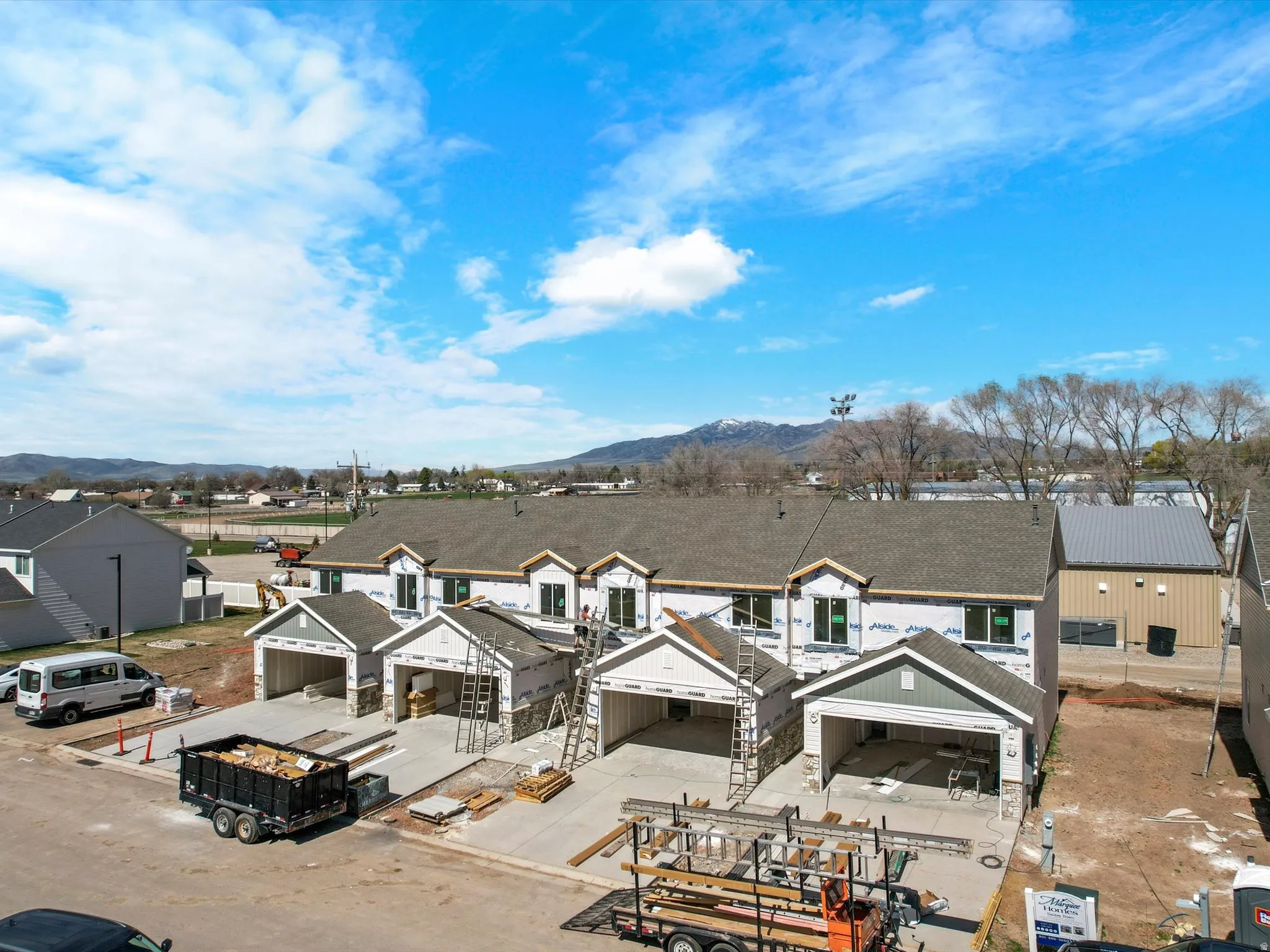 Aerial perspective of suburban area featuring a mountain backdrop