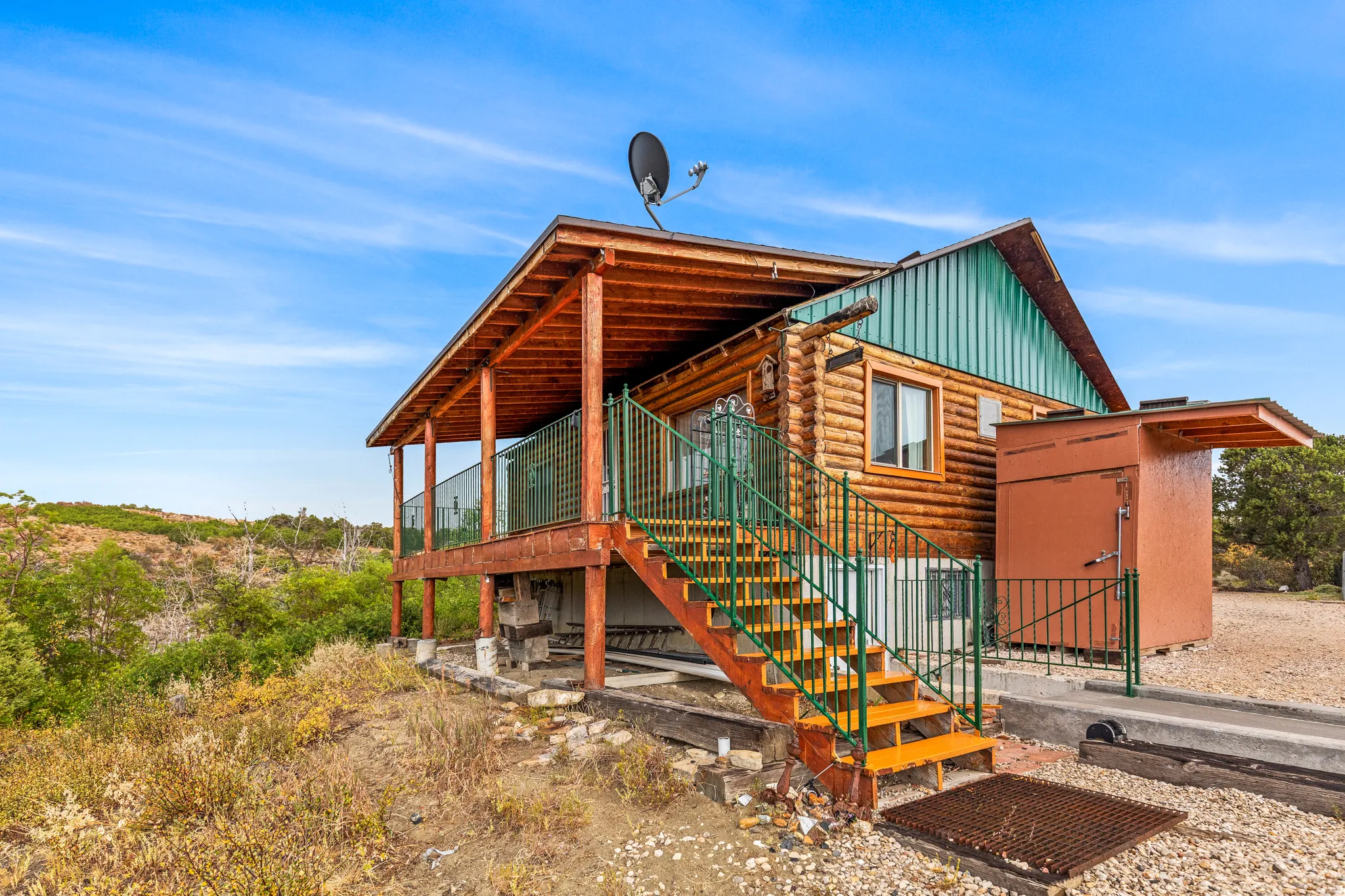 View of front of property featuring board and batten siding and log exterior