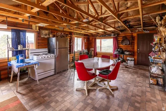 Dining space with rustic walls