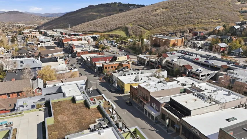 Aerial overview of property's location featuring a mountain backdrop