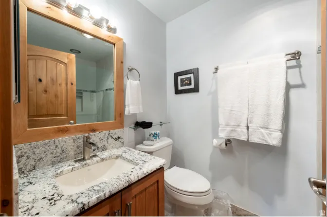Bathroom featuring vanity and a shower