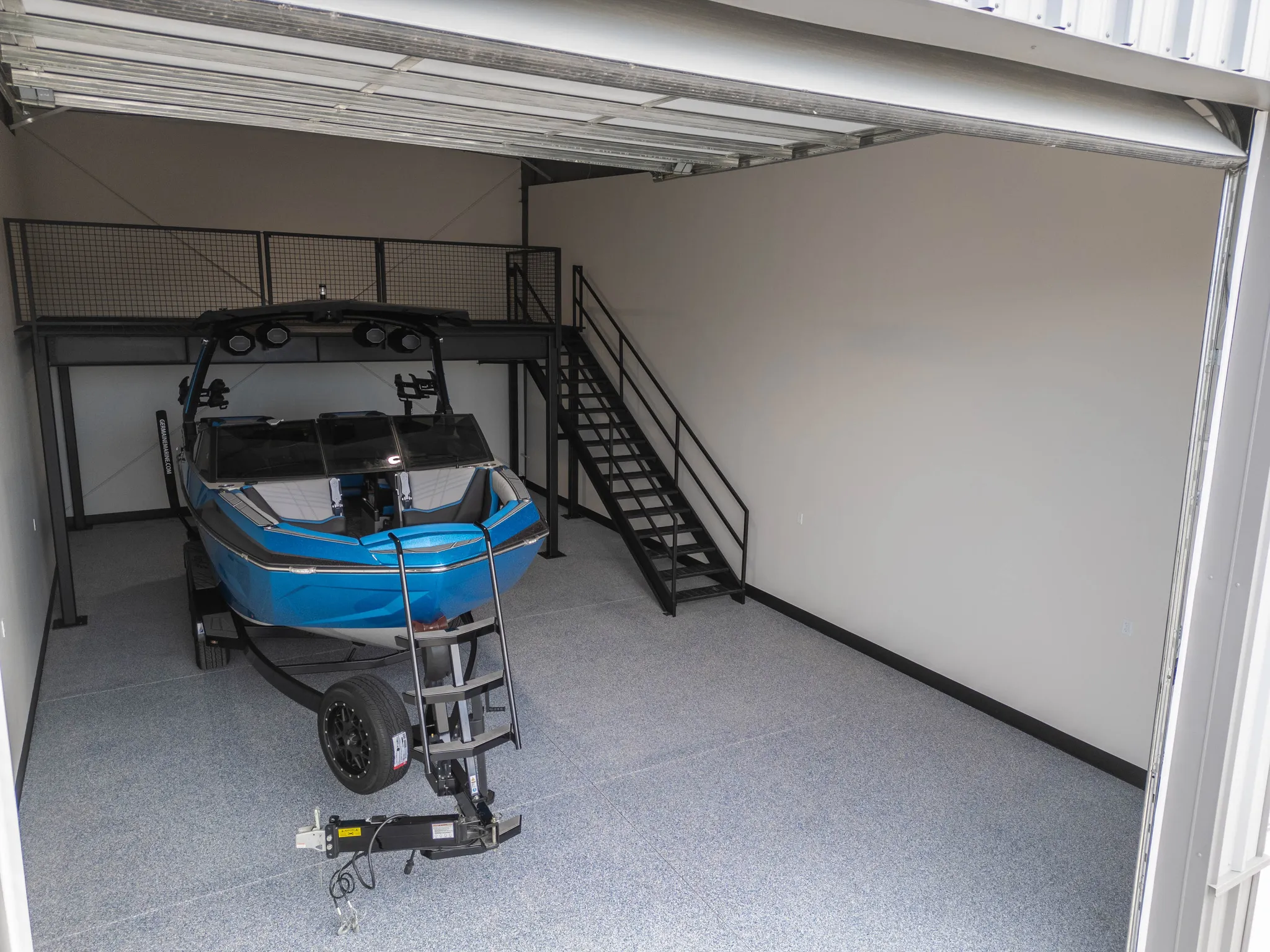 Garage featuring baseboards