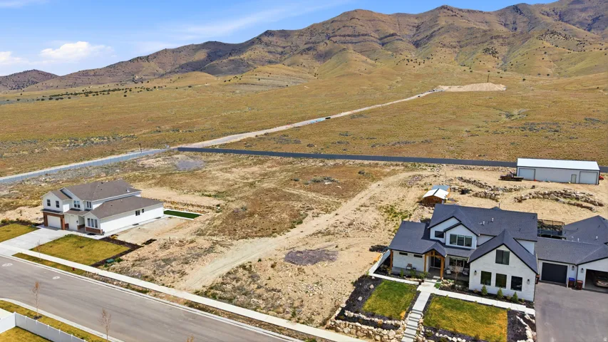 Aerial view of sparsely populated area featuring a mountainous background