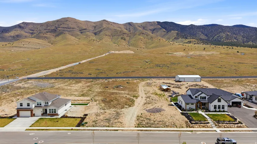 Overview of rural landscape featuring a mountain backdrop