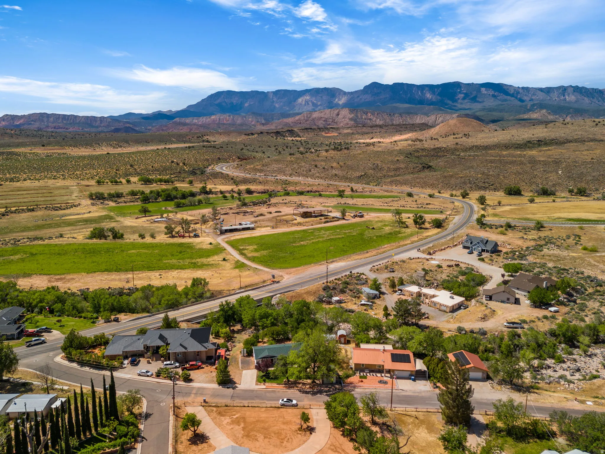 Aerial view of sparsely populated area featuring a mountain backdrop