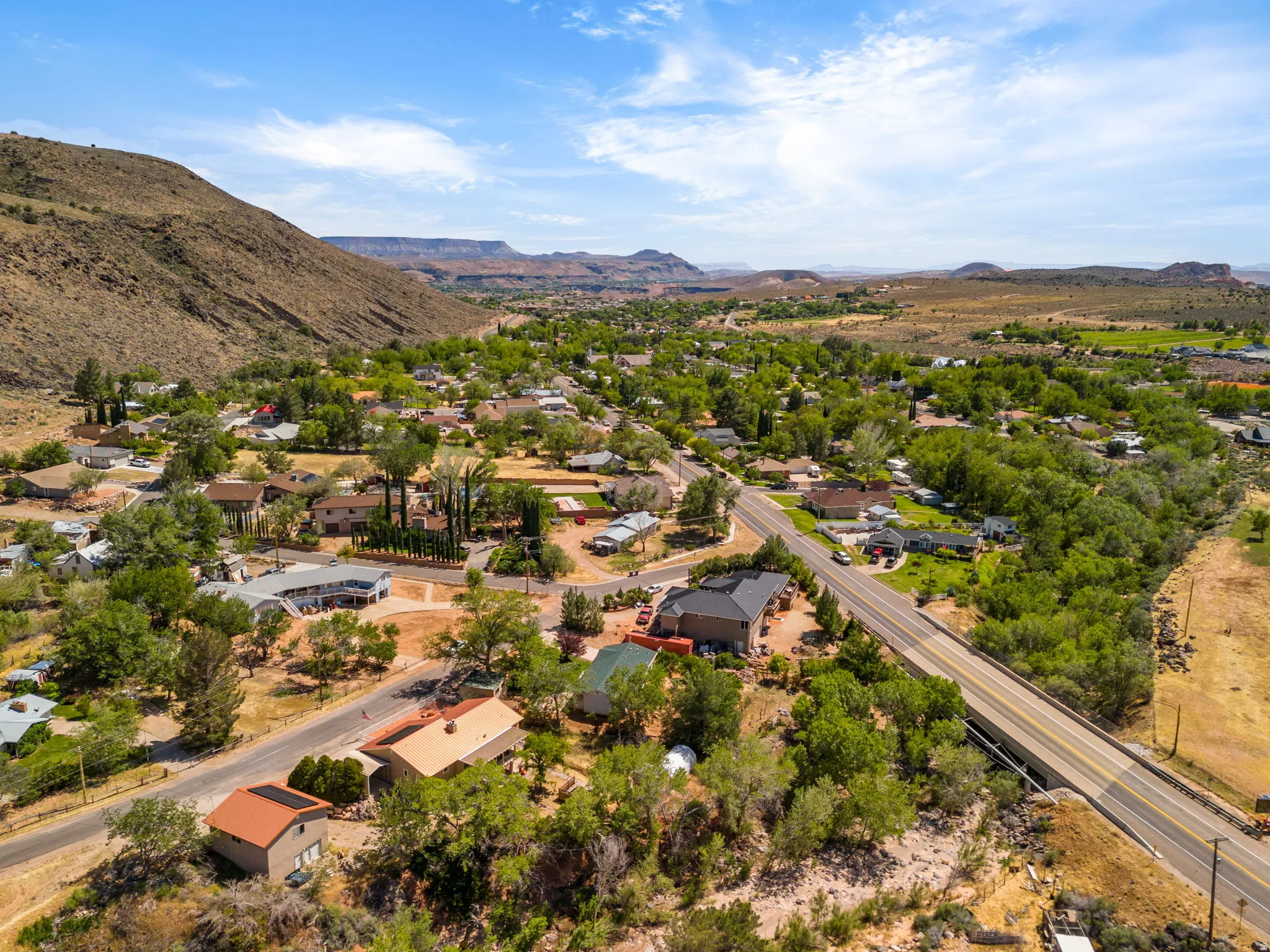 Aerial perspective of suburban area featuring a mountainous background