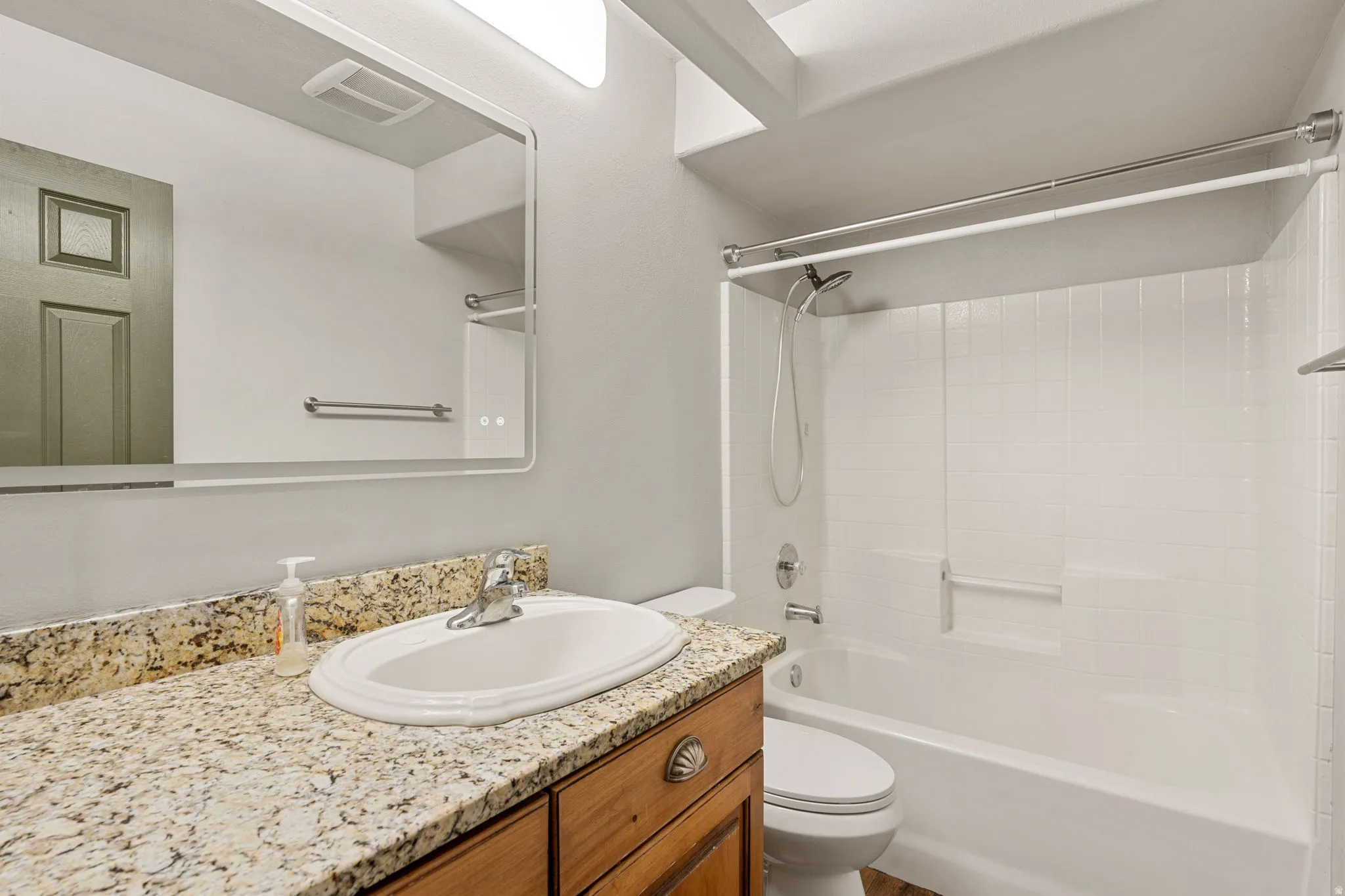 Bathroom 2 with vanity and shower / washtub combination