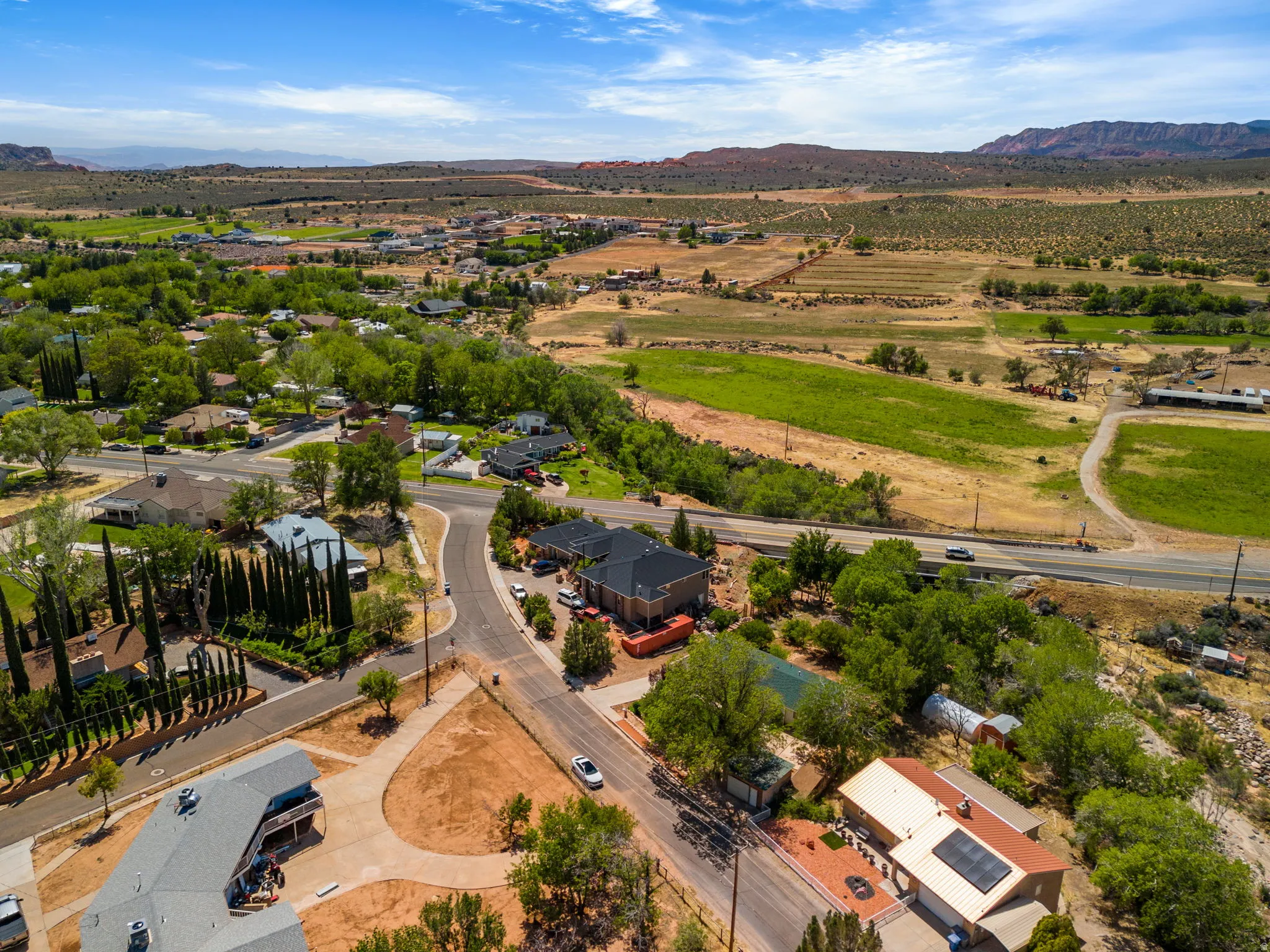 Aerial view of residential area with a mountainous background