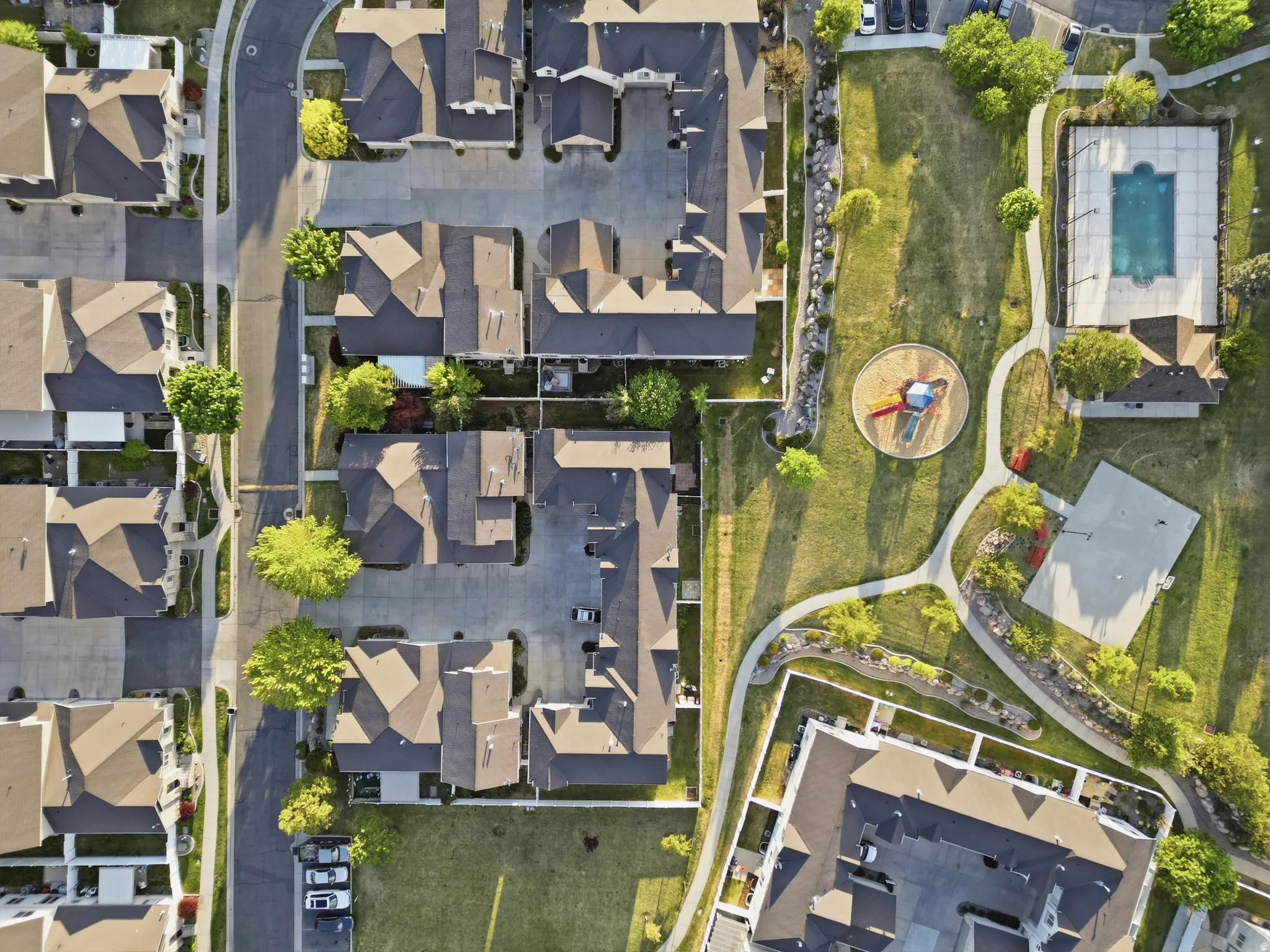 Aerial view of property and surrounding area featuring nearby suburban area
