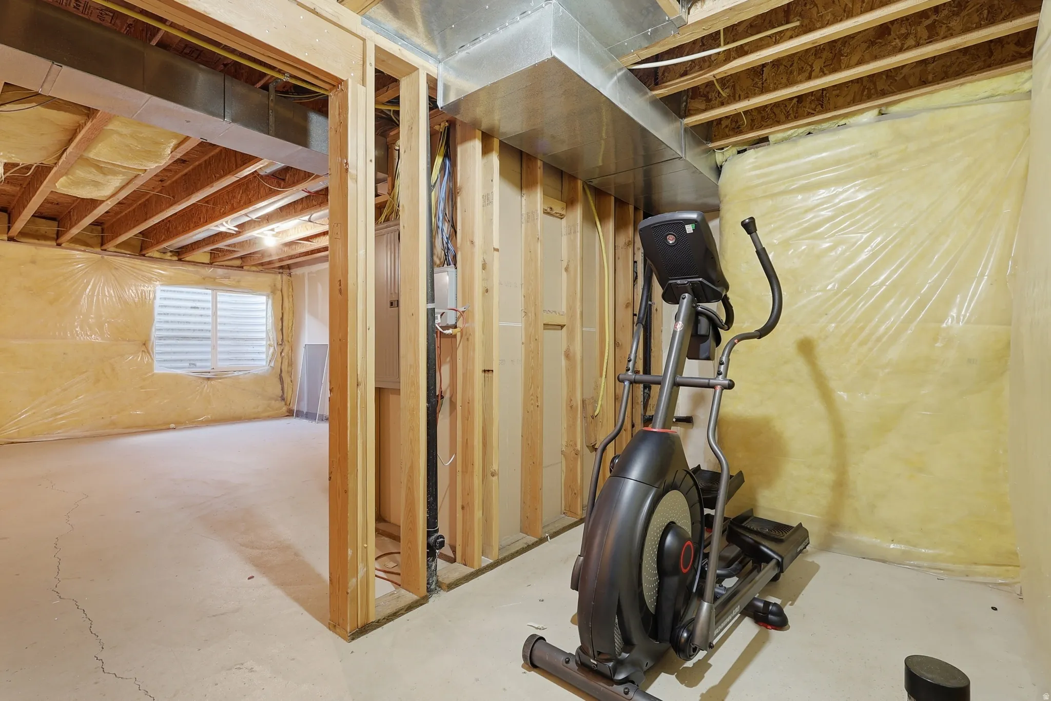 Exercise area featuring concrete floors