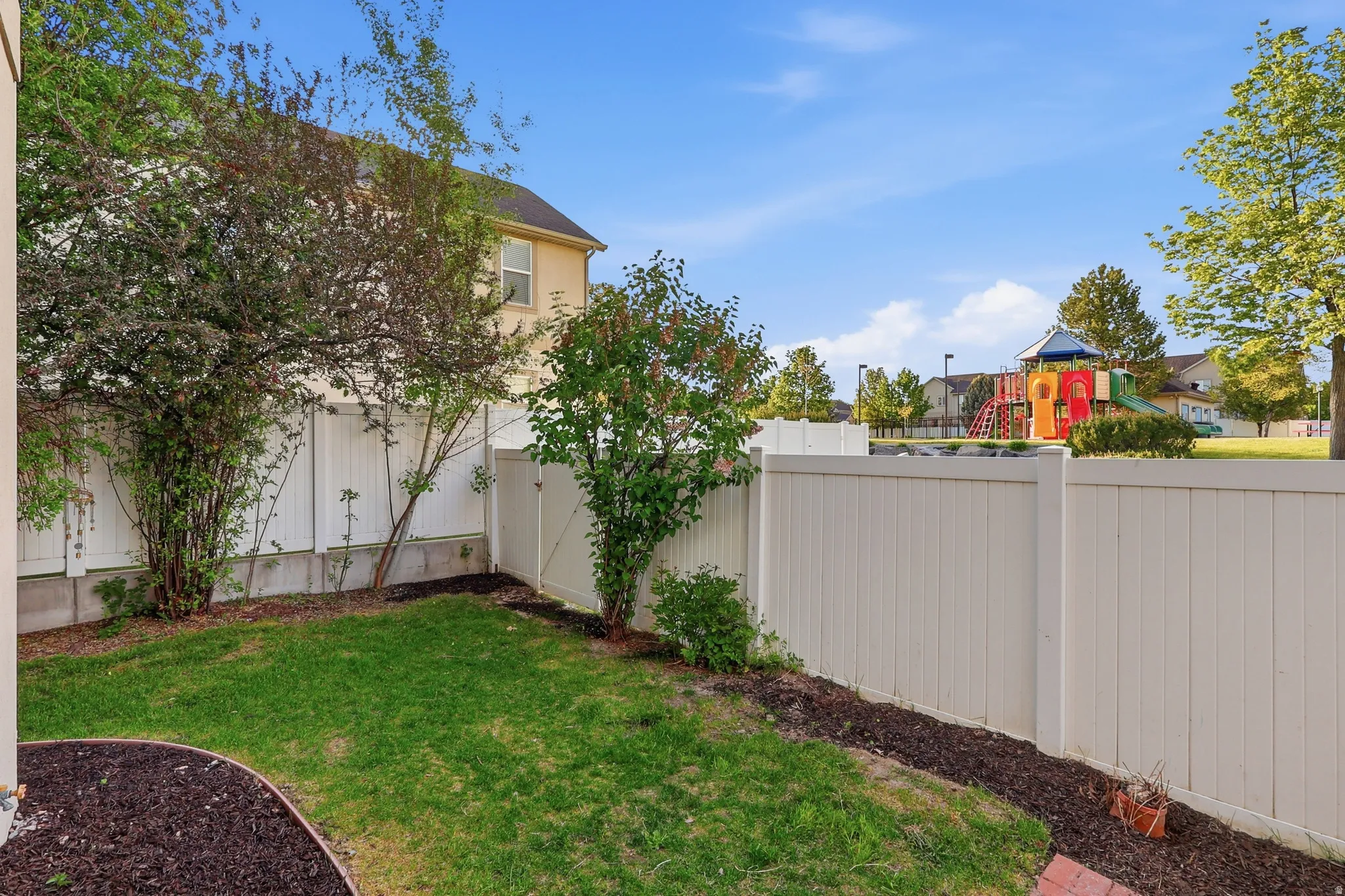 View of fenced backyard
