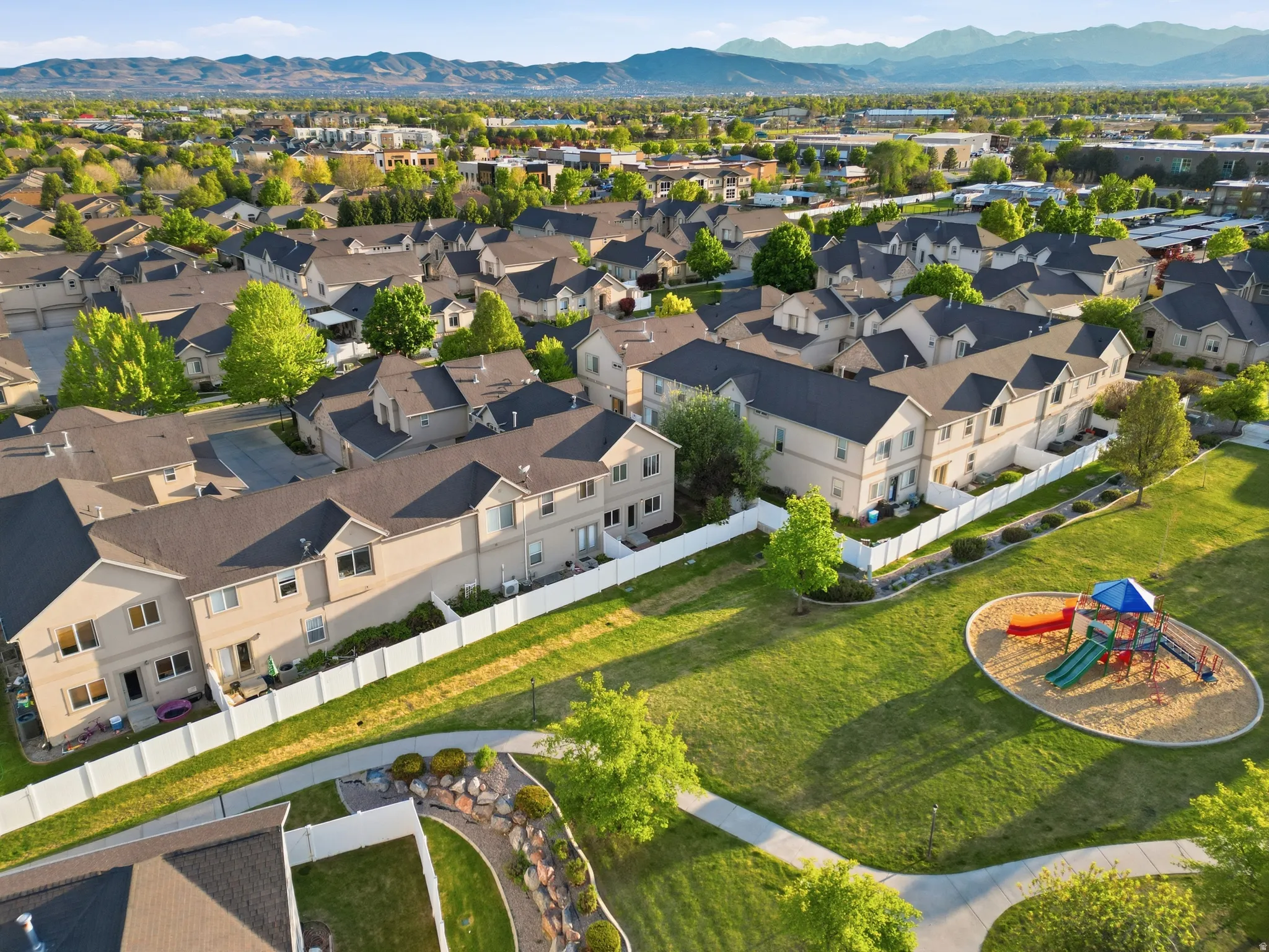 Aerial perspective of suburban area featuring a mountainous background