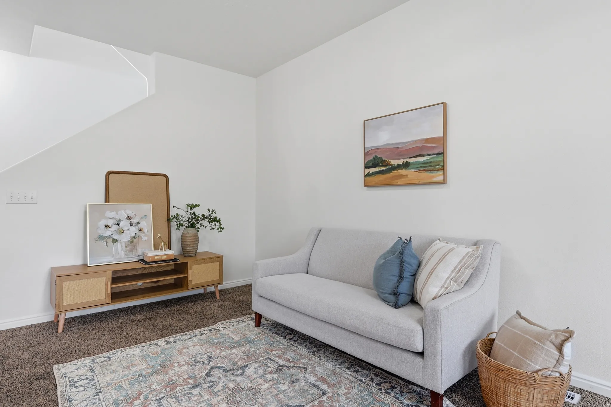 Sitting room with carpet flooring and baseboards