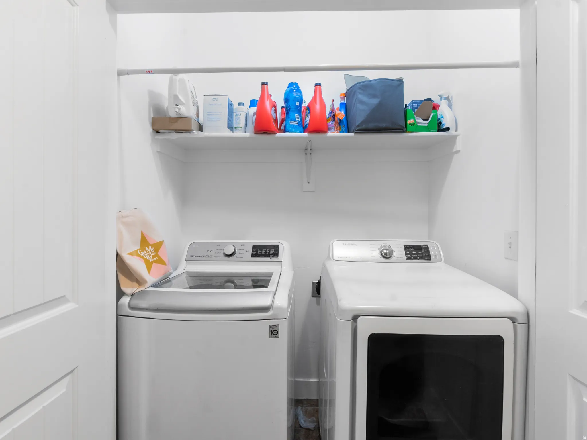 Laundry area featuring washer and clothes dryer