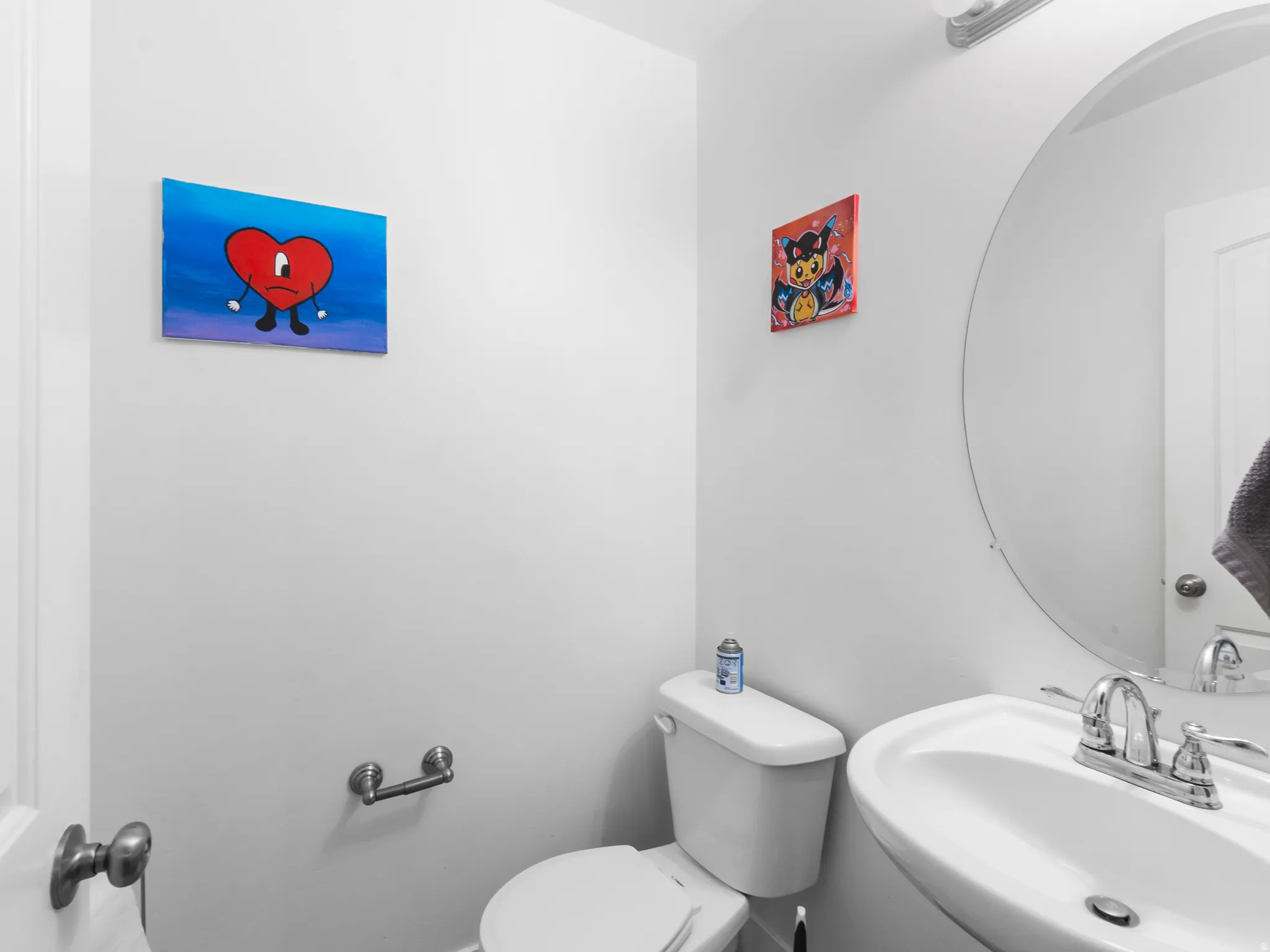 Half bathroom featuring a sink and toilet