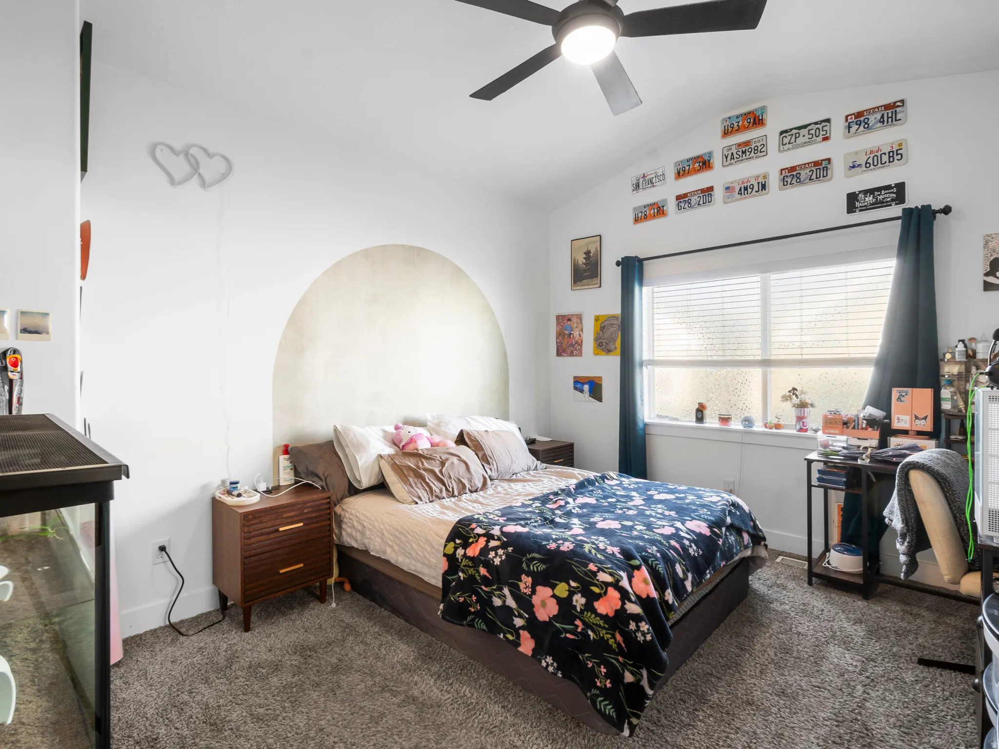 Bedroom featuring lofted ceiling, dark colored carpet, and ceiling fan