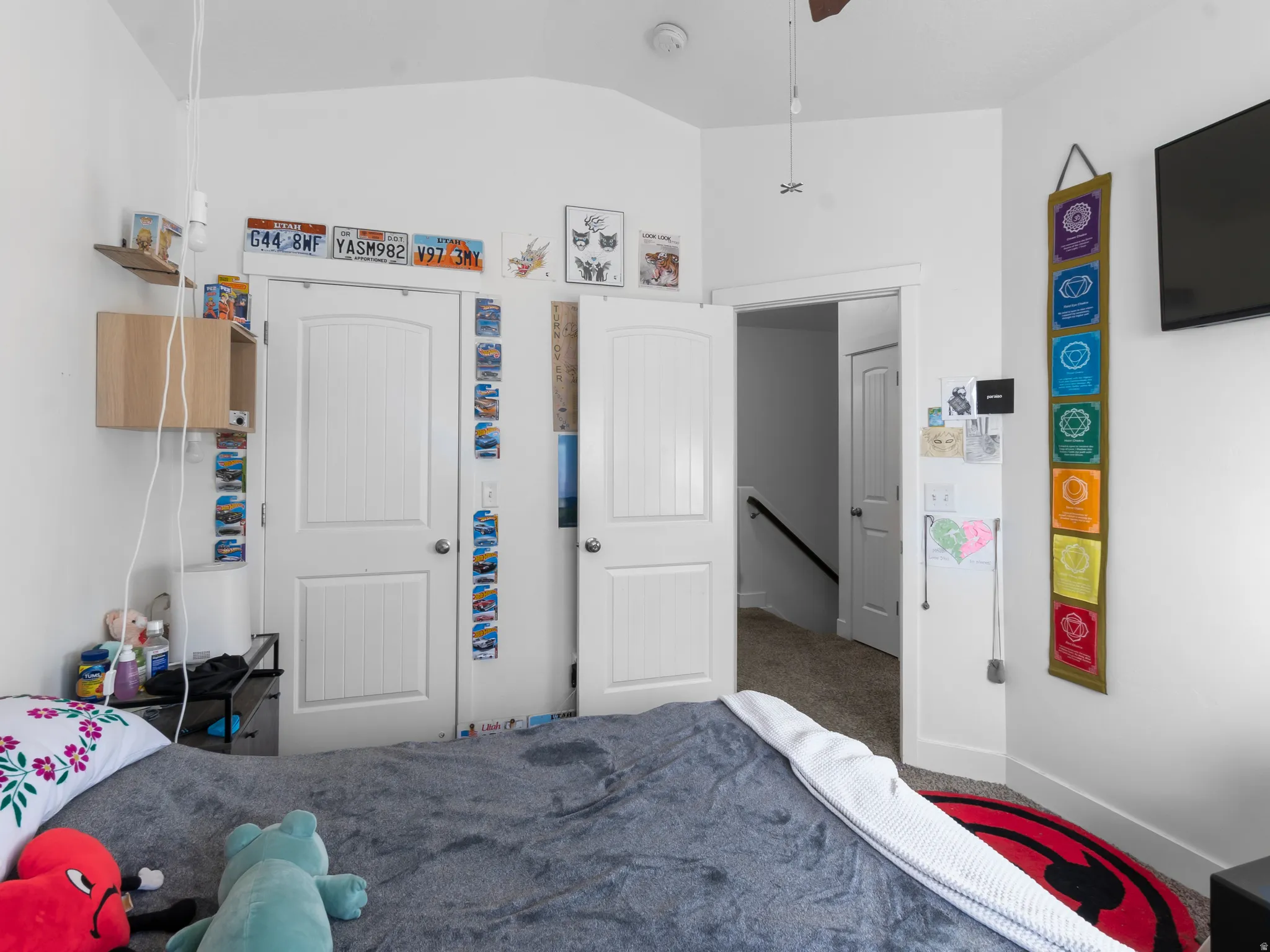 Bedroom with lofted ceiling and carpet