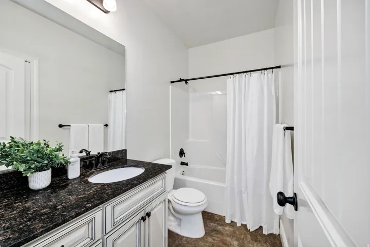 Full bathroom with vanity and shower / bath combination with curtain