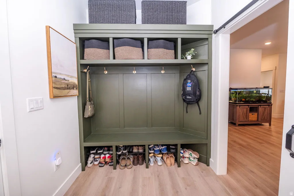 Mudroom featuring light wood-style floors and recessed lighting