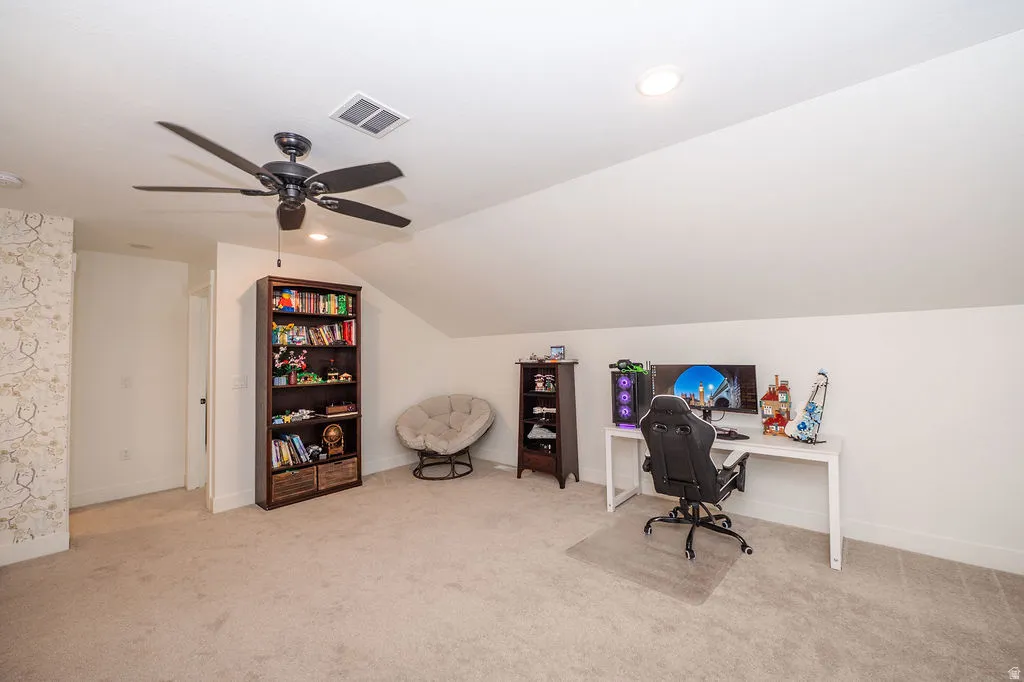 Office with lofted ceiling, light colored carpet, ceiling fan, and recessed lighting