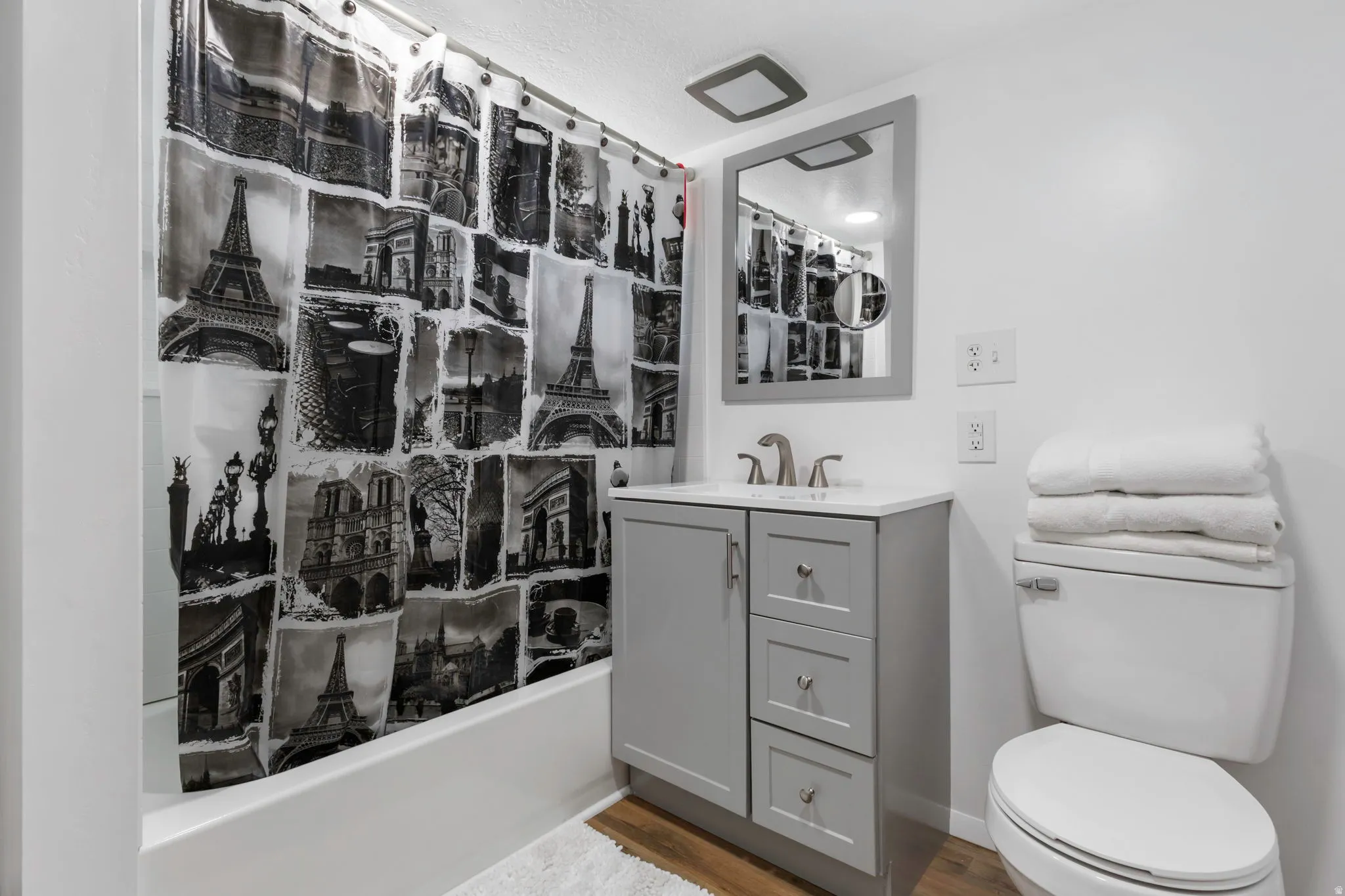 Full bathroom featuring vanity and light wood-style flooring