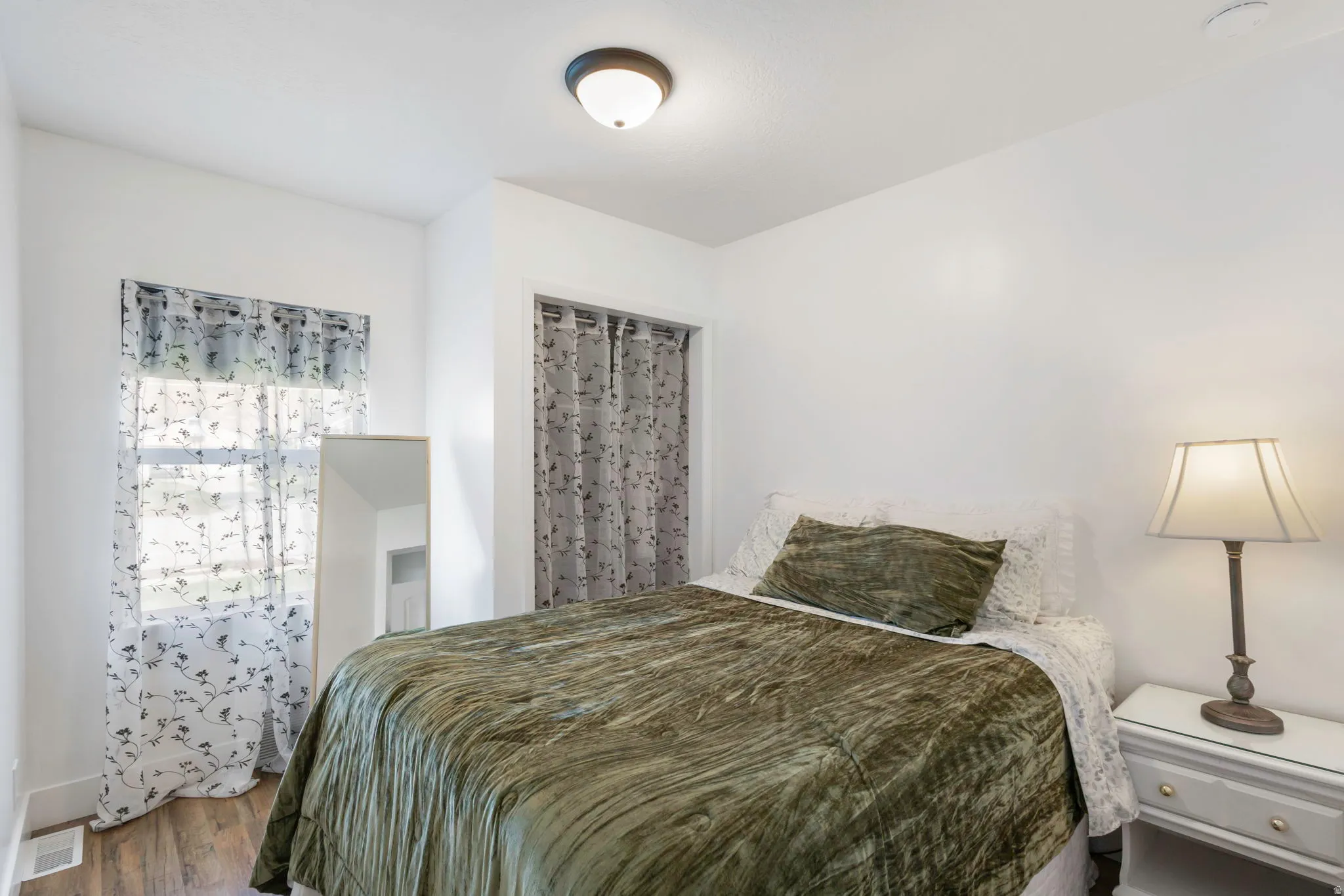 Bedroom featuring wood finished floors