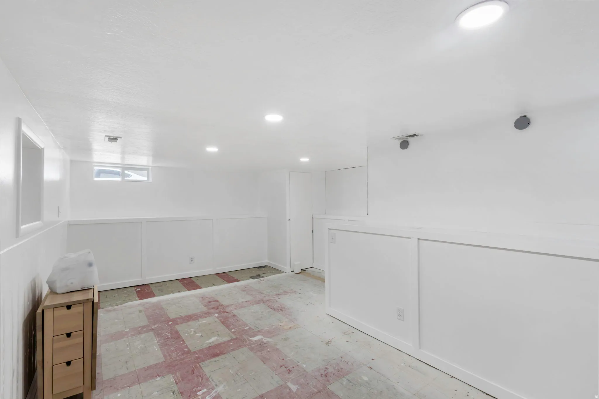 Basement featuring recessed lighting