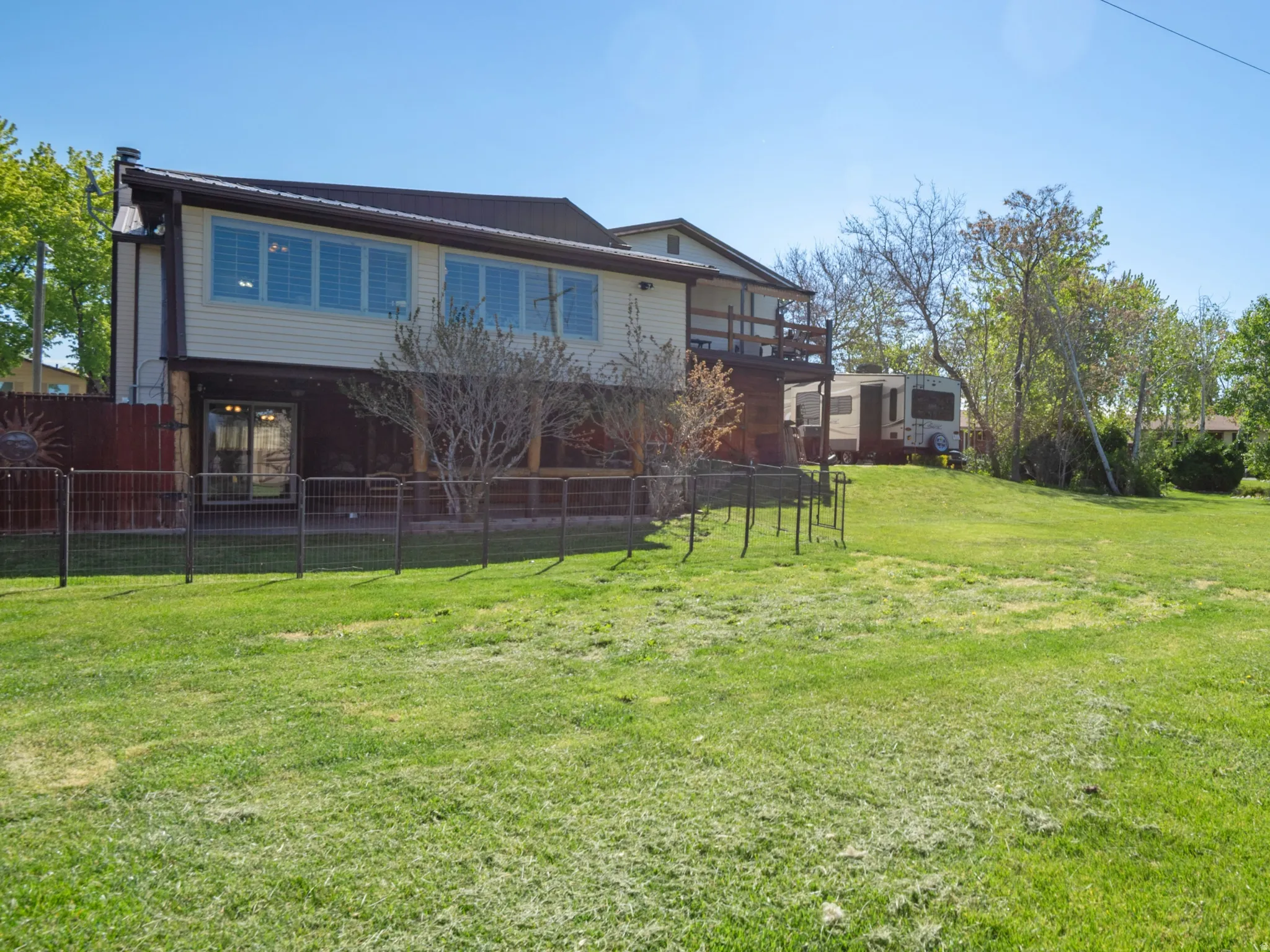 View of yard featuring a balcony