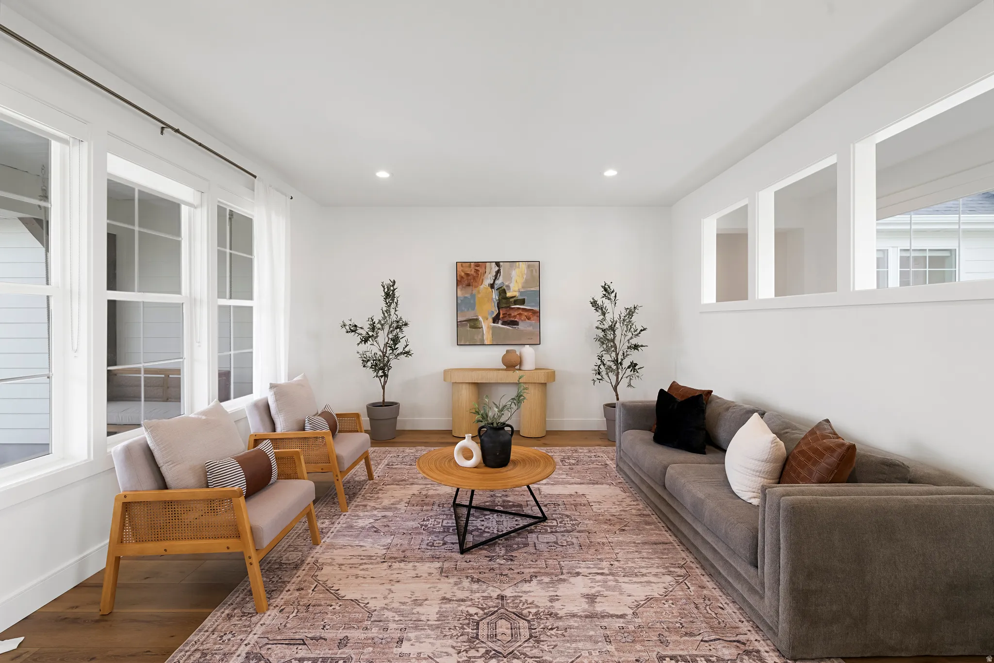 Living room featuring wood finished floors and recessed lighting