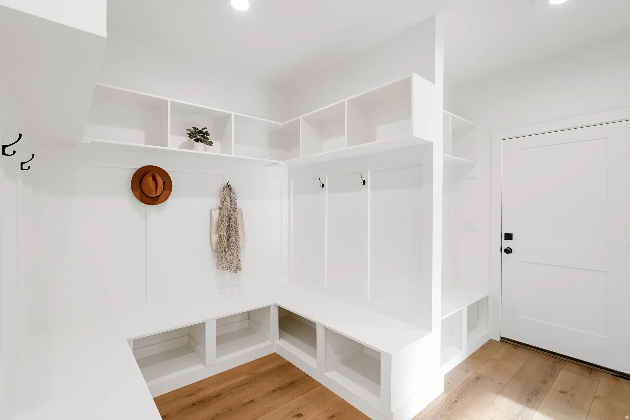 Mudroom with light wood-type flooring and recessed lighting