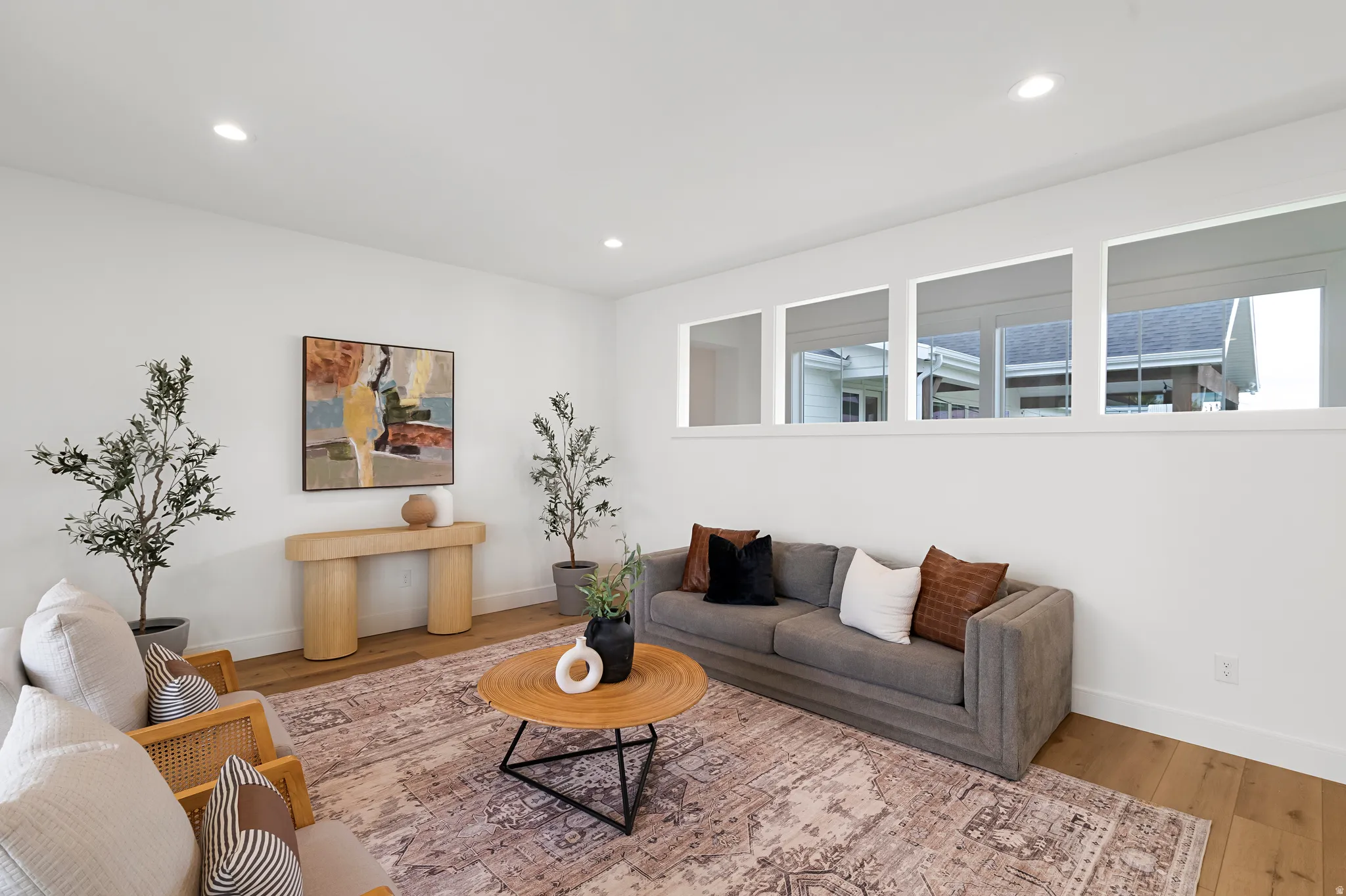 Living area featuring wood finished floors and recessed lighting